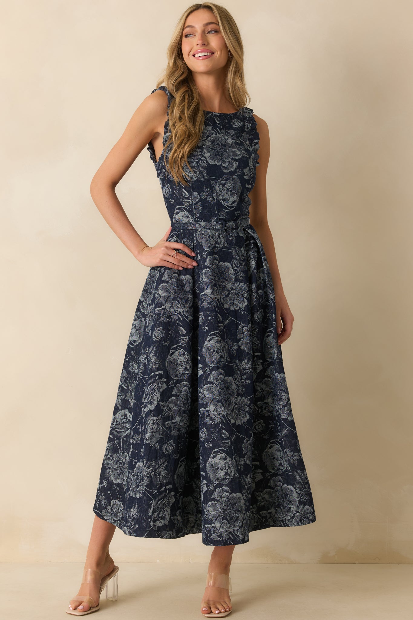 A slightly angled front view emphasizing the fitted bodice, structured fabric, and skirt movement.