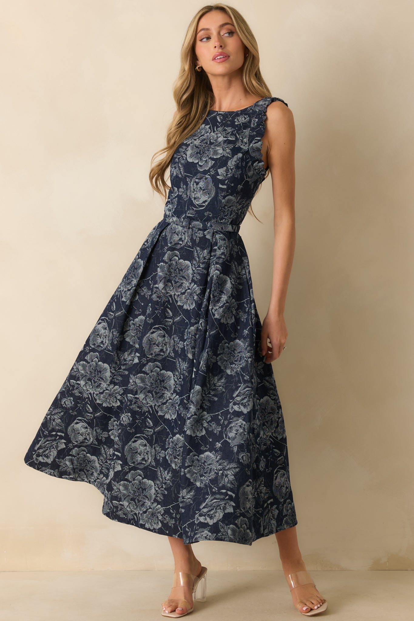 An angled front view highlighting the elastic ruffle-trim straps and optional belt at the waist.