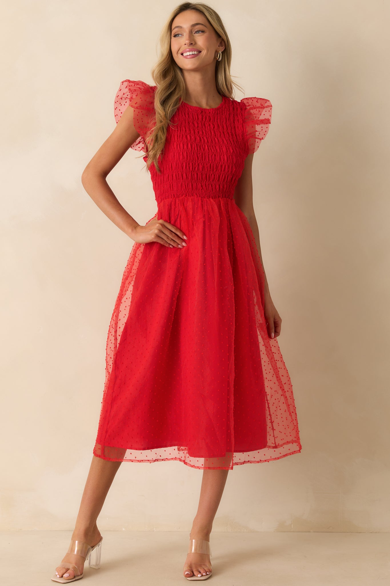 Dress featuring a fully smocked bodice with polka dot tulle overlay.