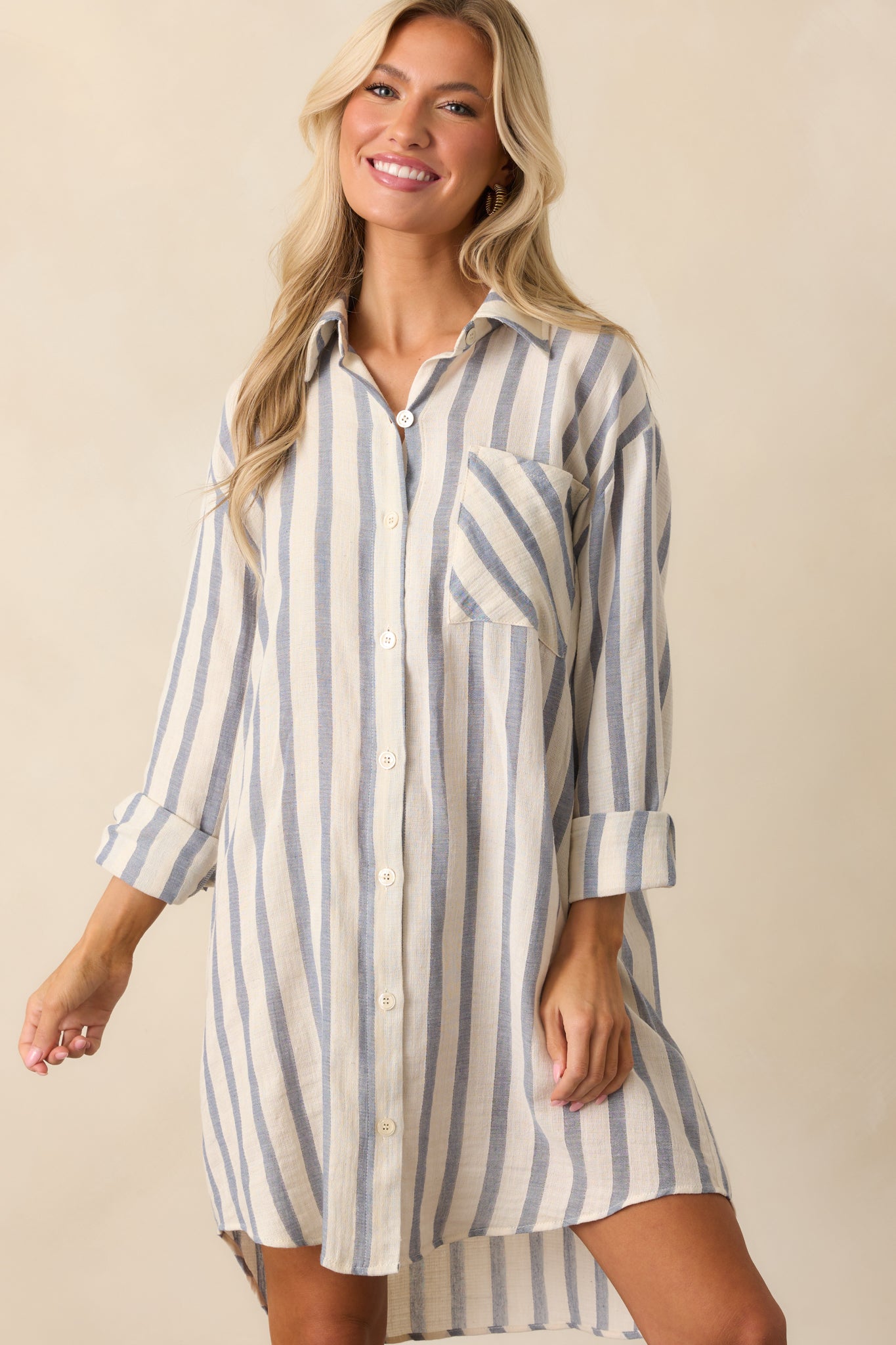 Cropped view of the upper section of the dress showing the collar, stripes, and functional breast pocket.