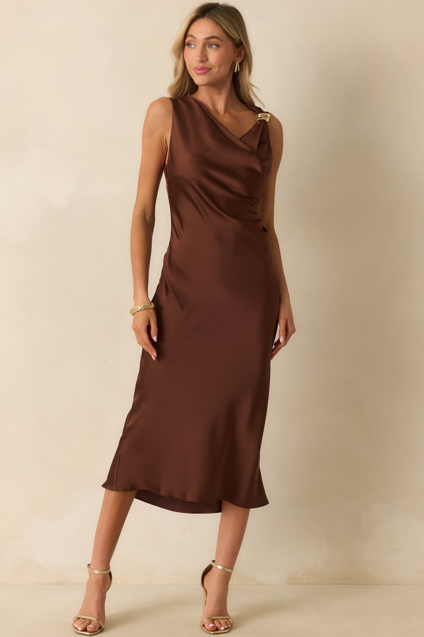Dress styled with smooth satin draping and a relaxed silhouette.