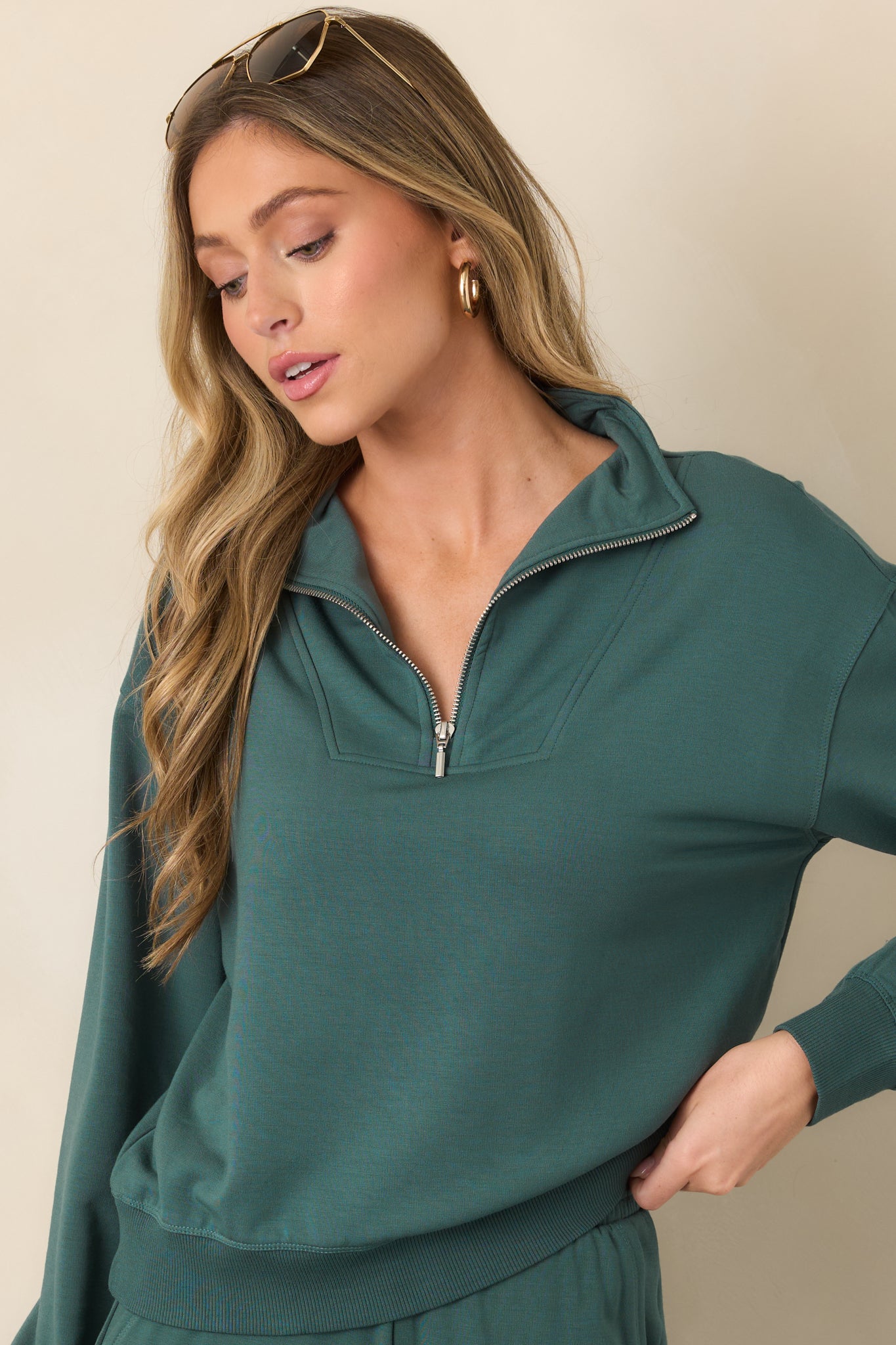 Detailed view of the dropped shoulder and long sleeve construction, emphasizing the sweatshirt's relaxed shape.