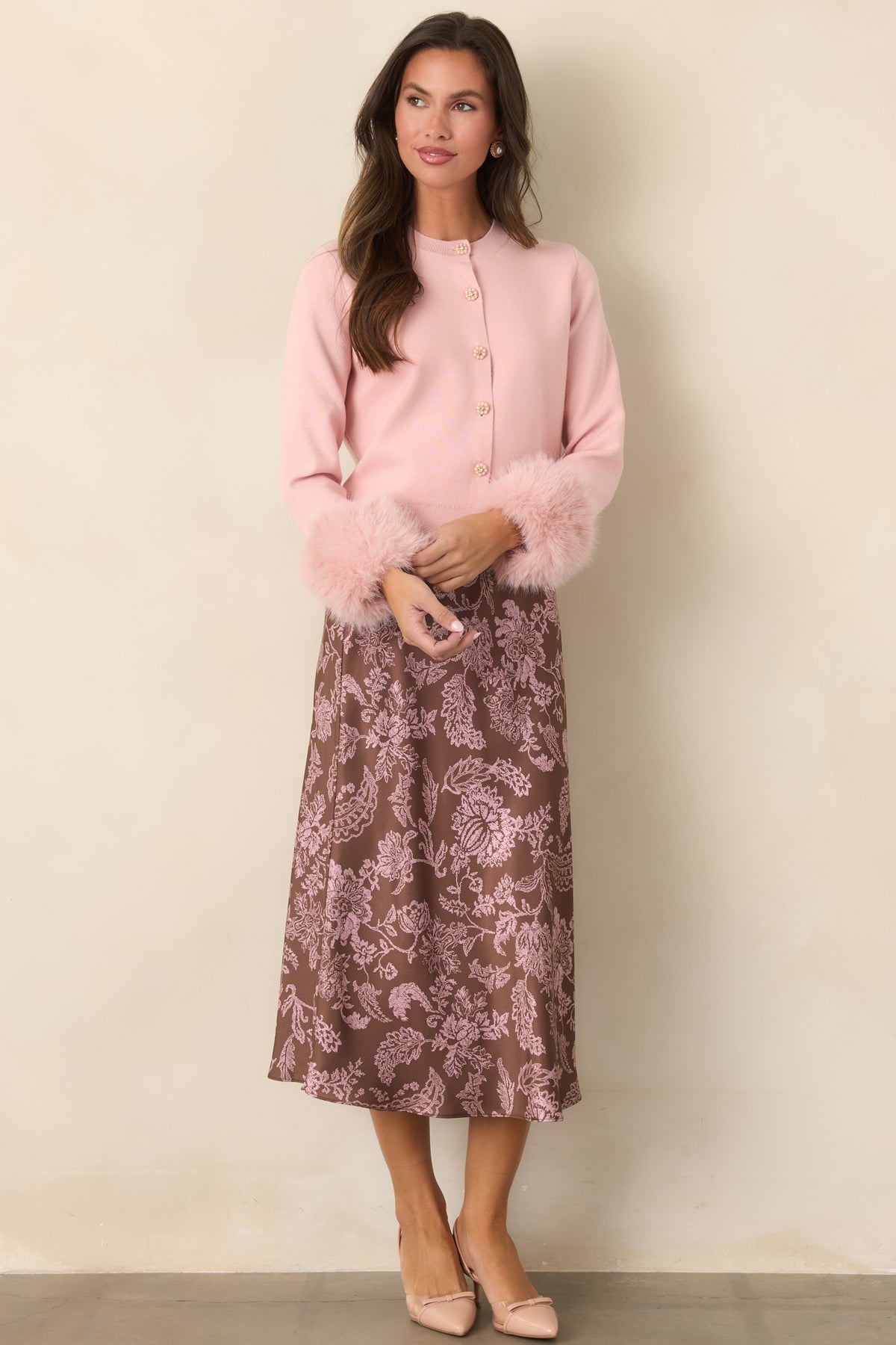Dusty pink cardigan with a classic round neckline, long sleeves, and neat hem.