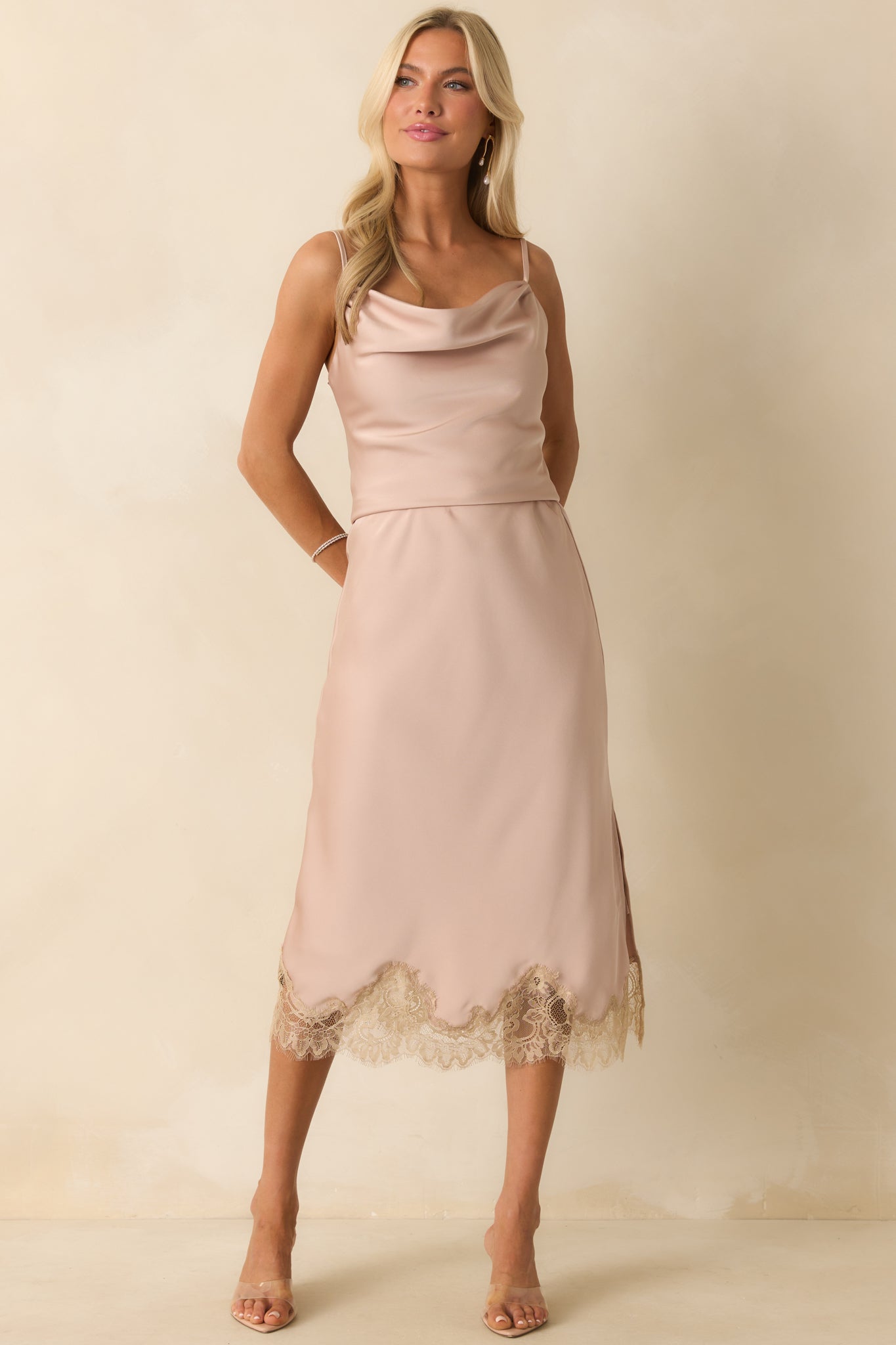 Satin cowl neck top in dusty pink highlighting the cropped length and smooth fabric drape