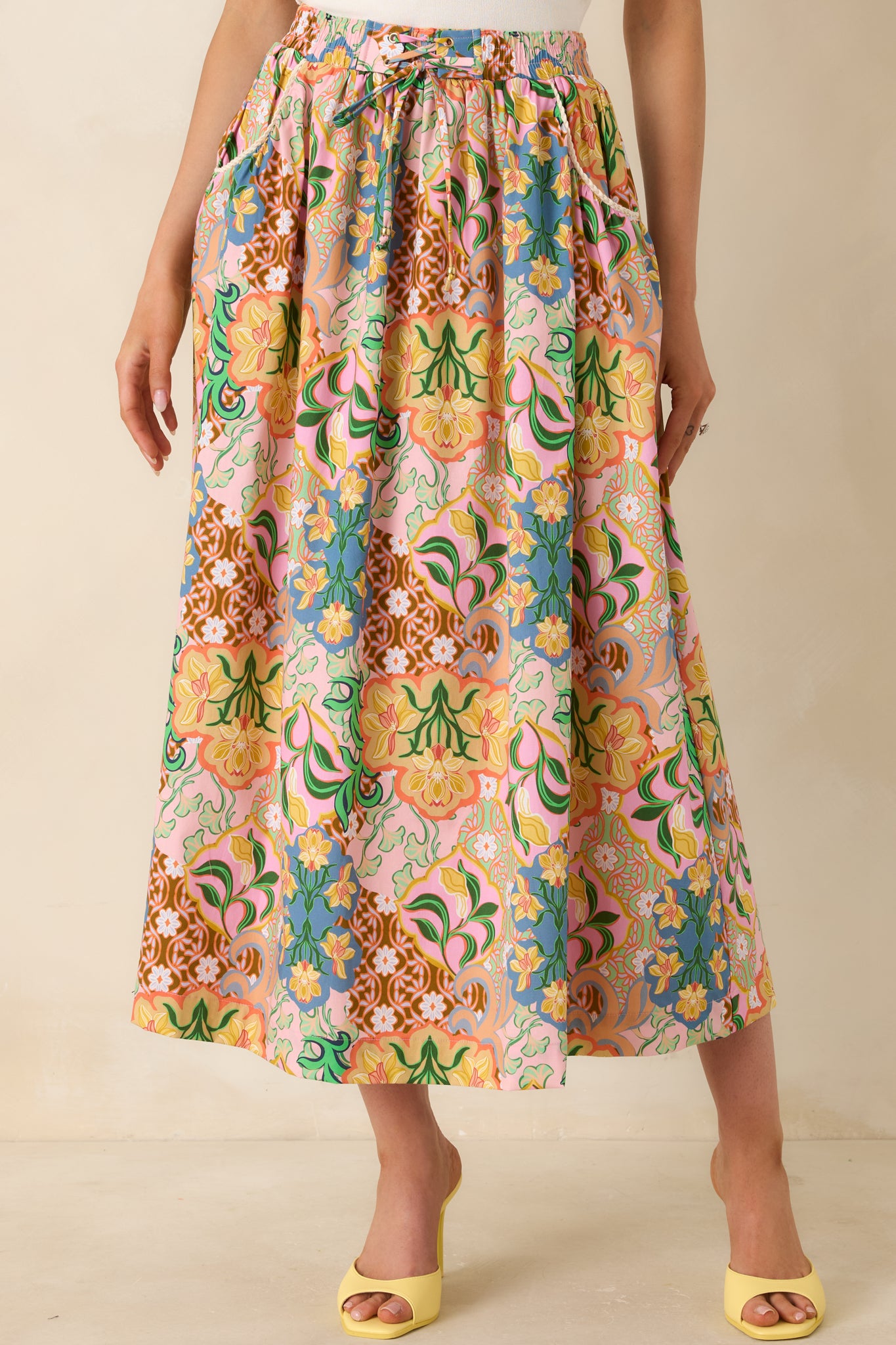 Elastic waistband with adjustable laced tie detail on lightweight cotton skirt.