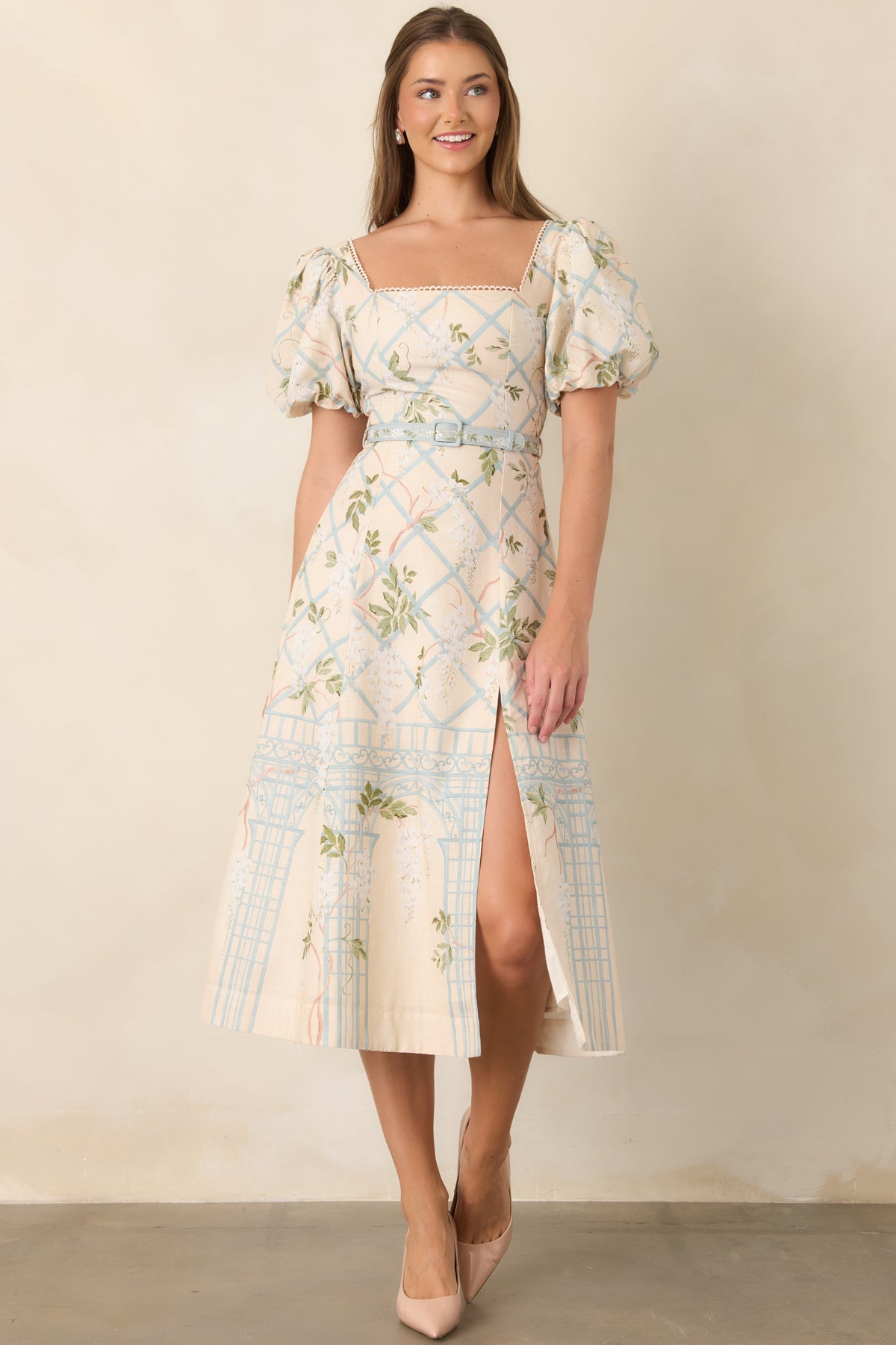 Elegant midi dress with puff sleeves, belted waist, and front slit
