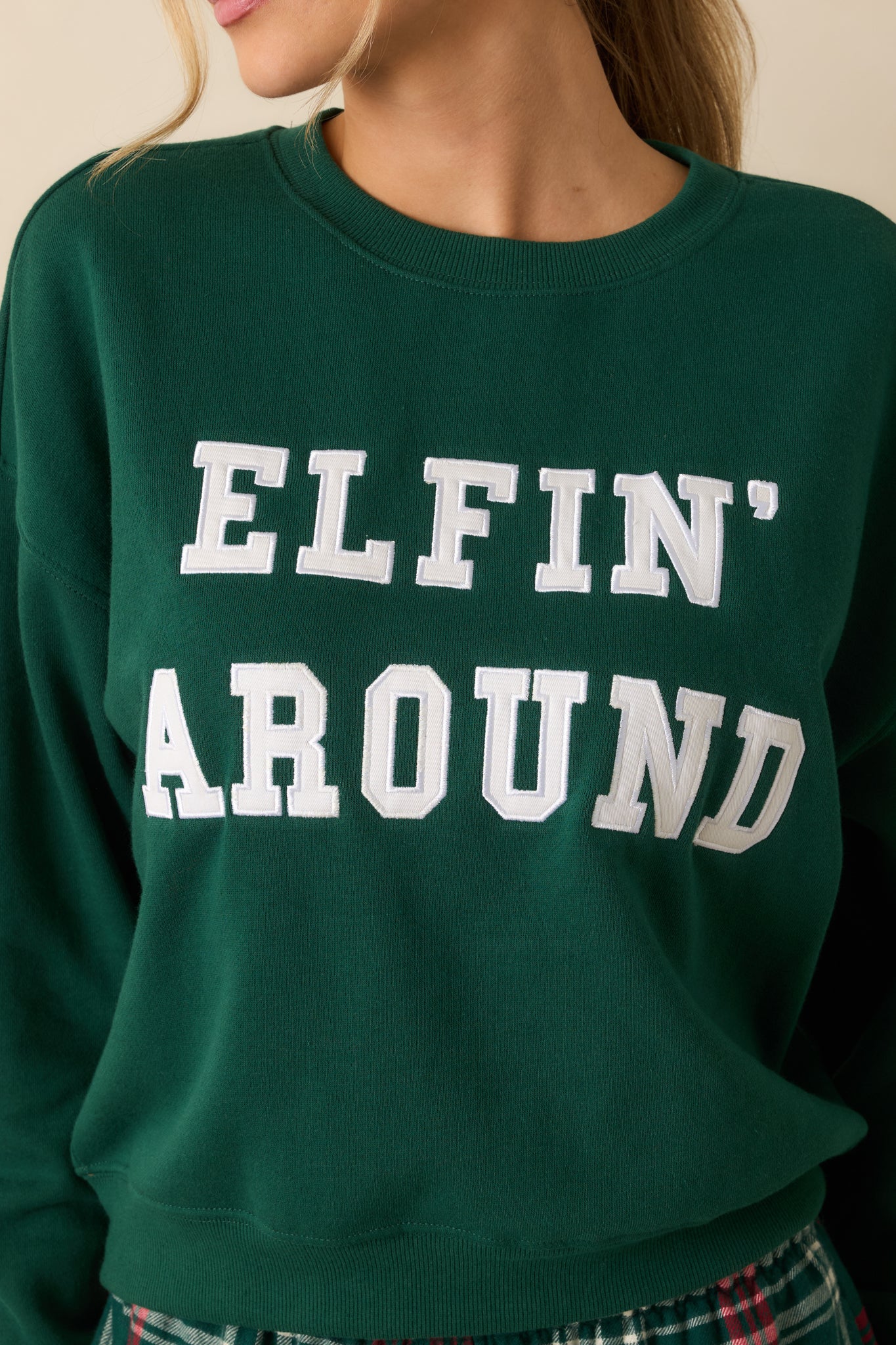 Twill “Elfin’ Around” applique on mistletoe green fleece, highlighting texture and festive embroidery.