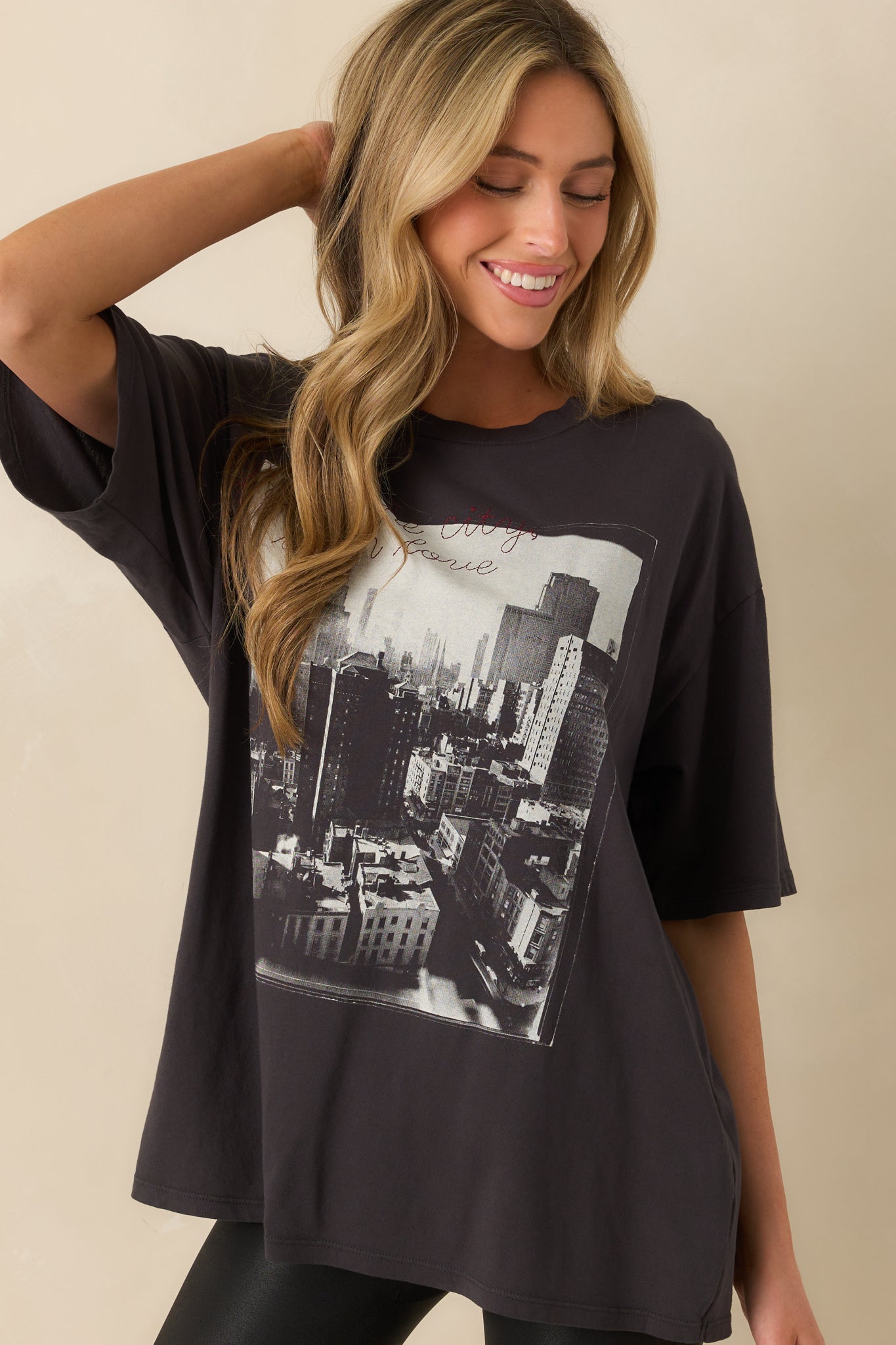 Embroidered “from the city with love” script in red thread over black and white graphic detail