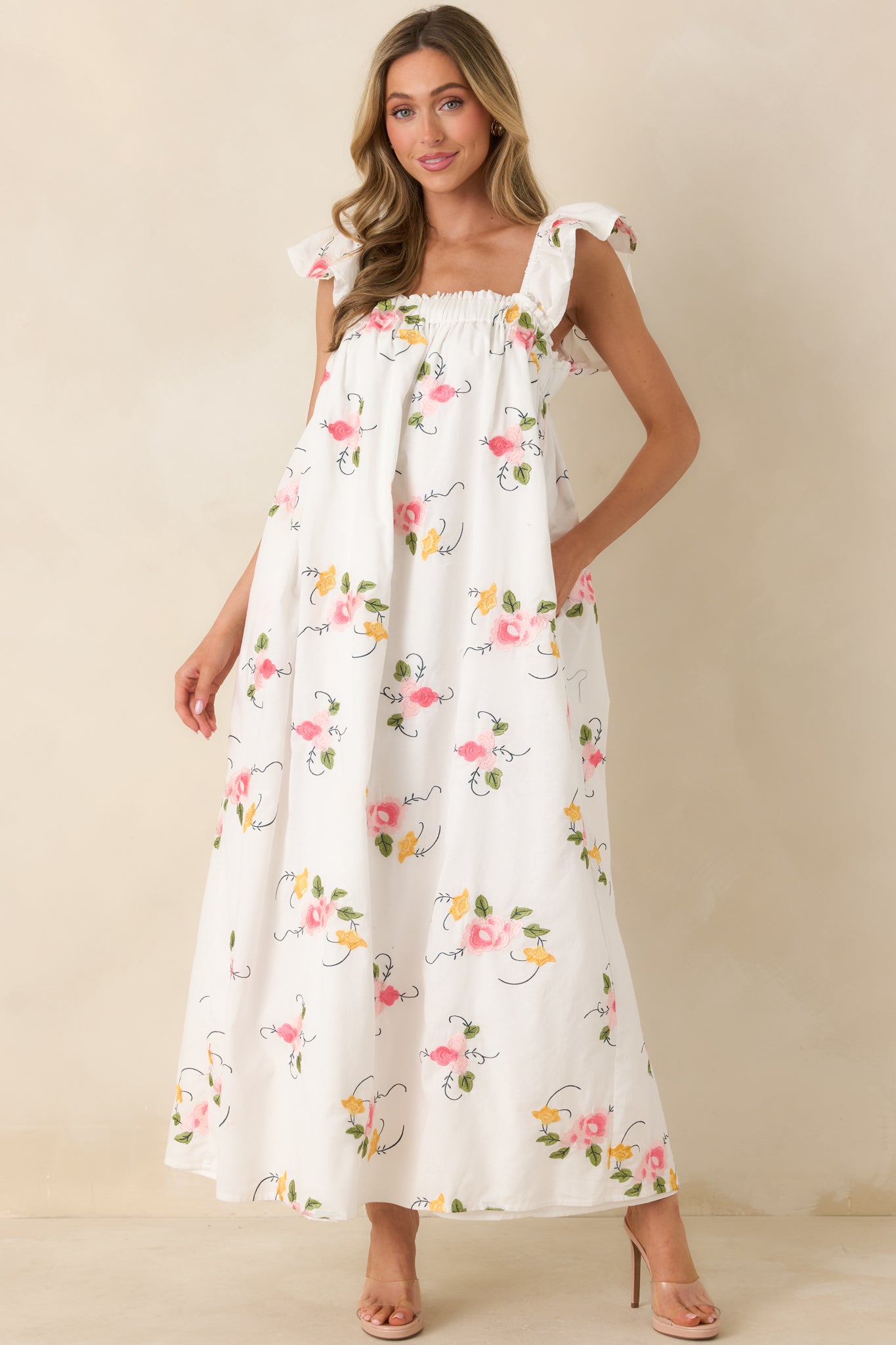 Flowing embroidered maxi designed with ruffled shoulder straps, a relaxed bodice, and a breezy skirt that drapes effortlessly.
