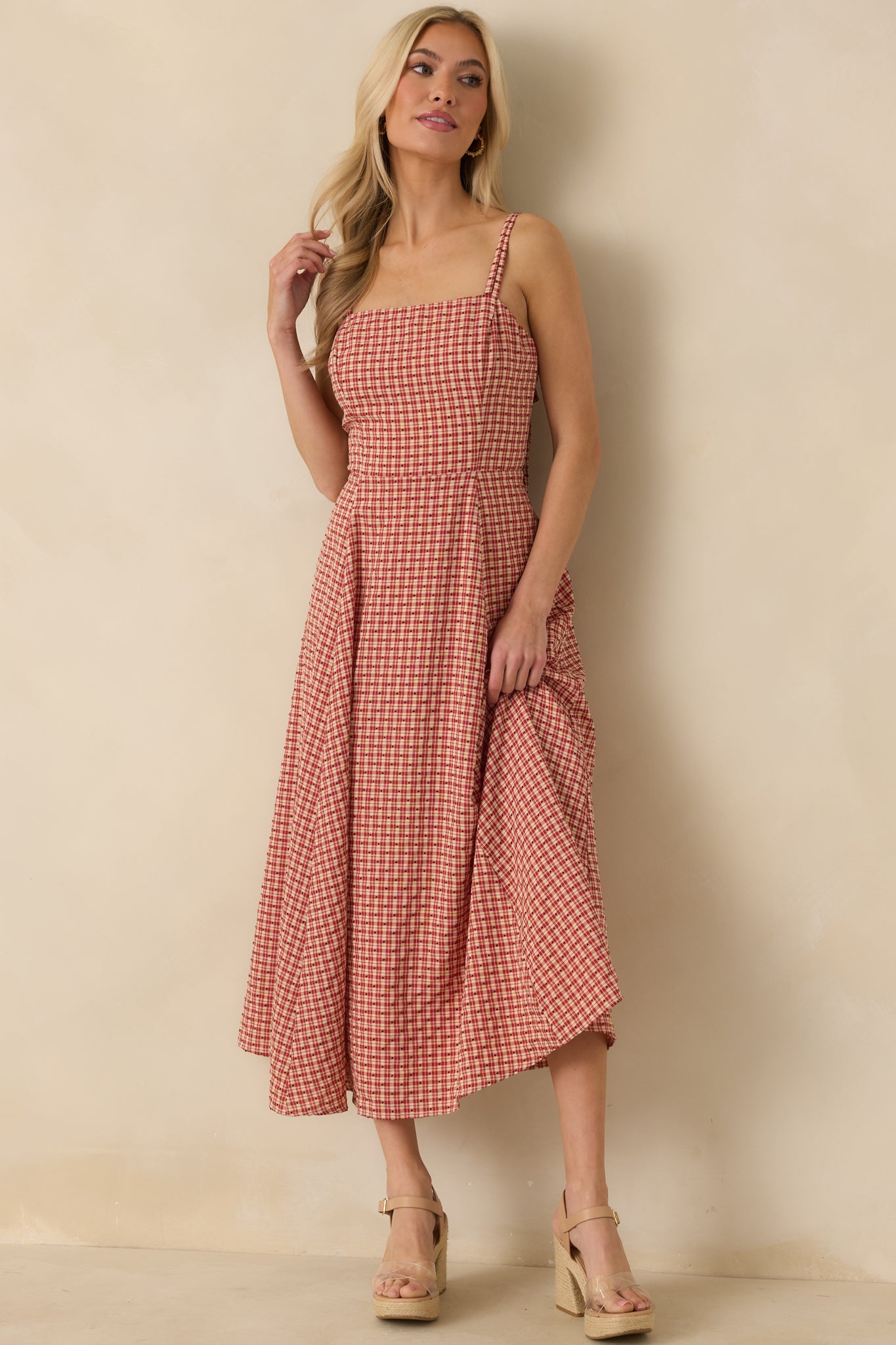 Embroidered red gingham dress with full-length silhouette and subtle textured polka dot details.