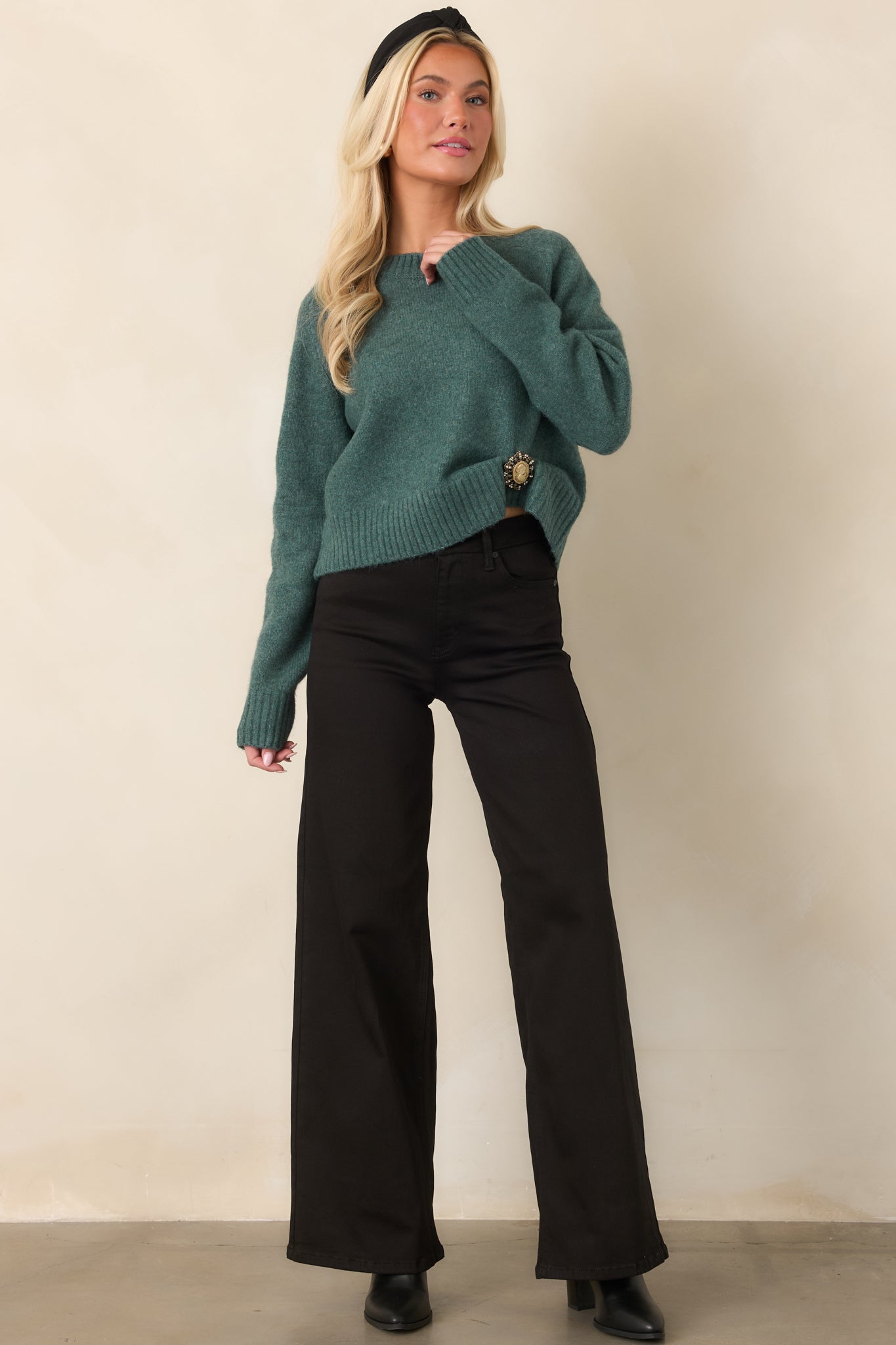 Soft fuzzy sweater in Emerald Cove green featuring a relaxed silhouette, ribbed crew neckline, long sleeves, and cropped hem.