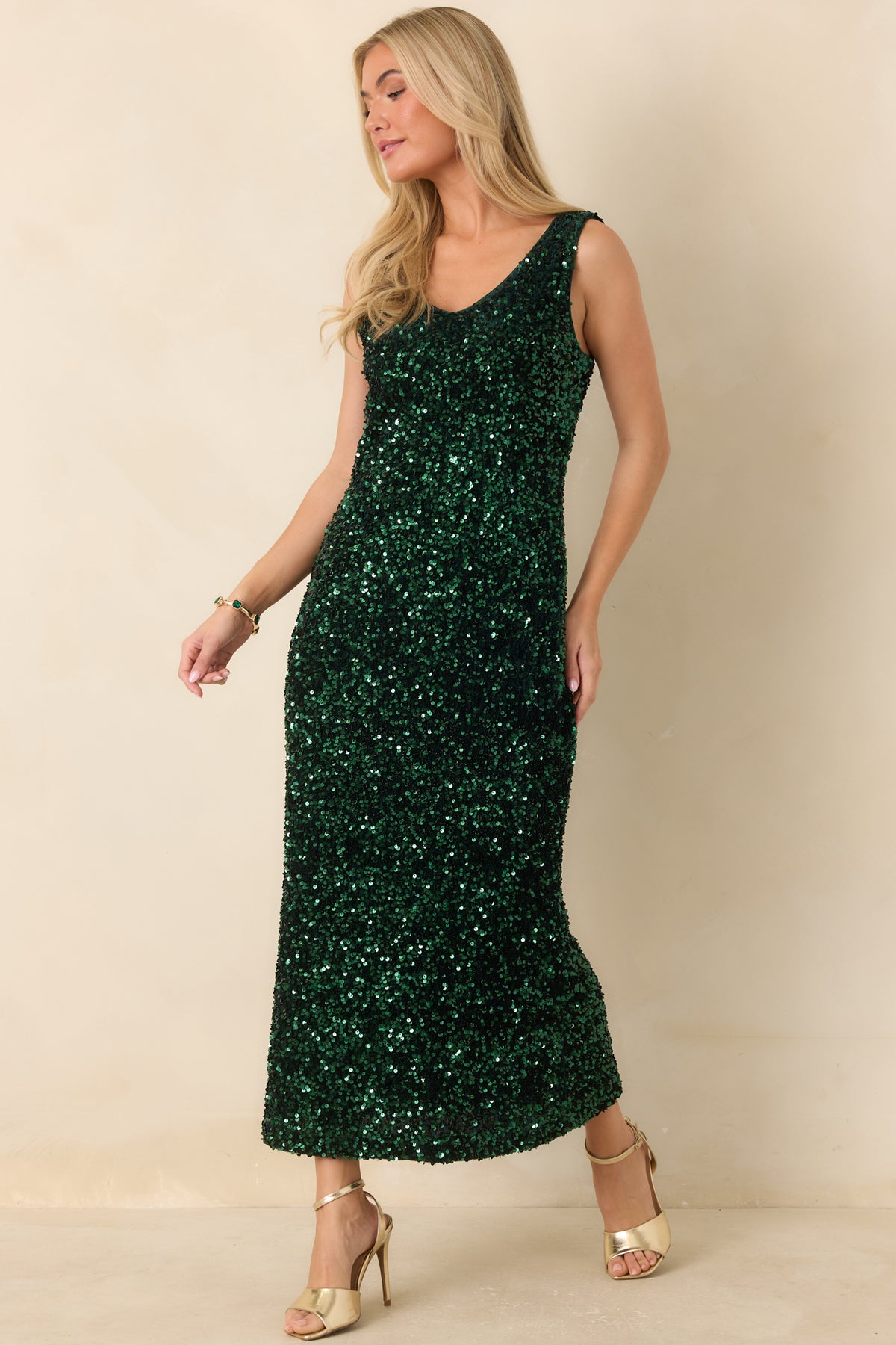 Emerald green midi dress with wide shoulder straps and a flattering curved V-neckline.