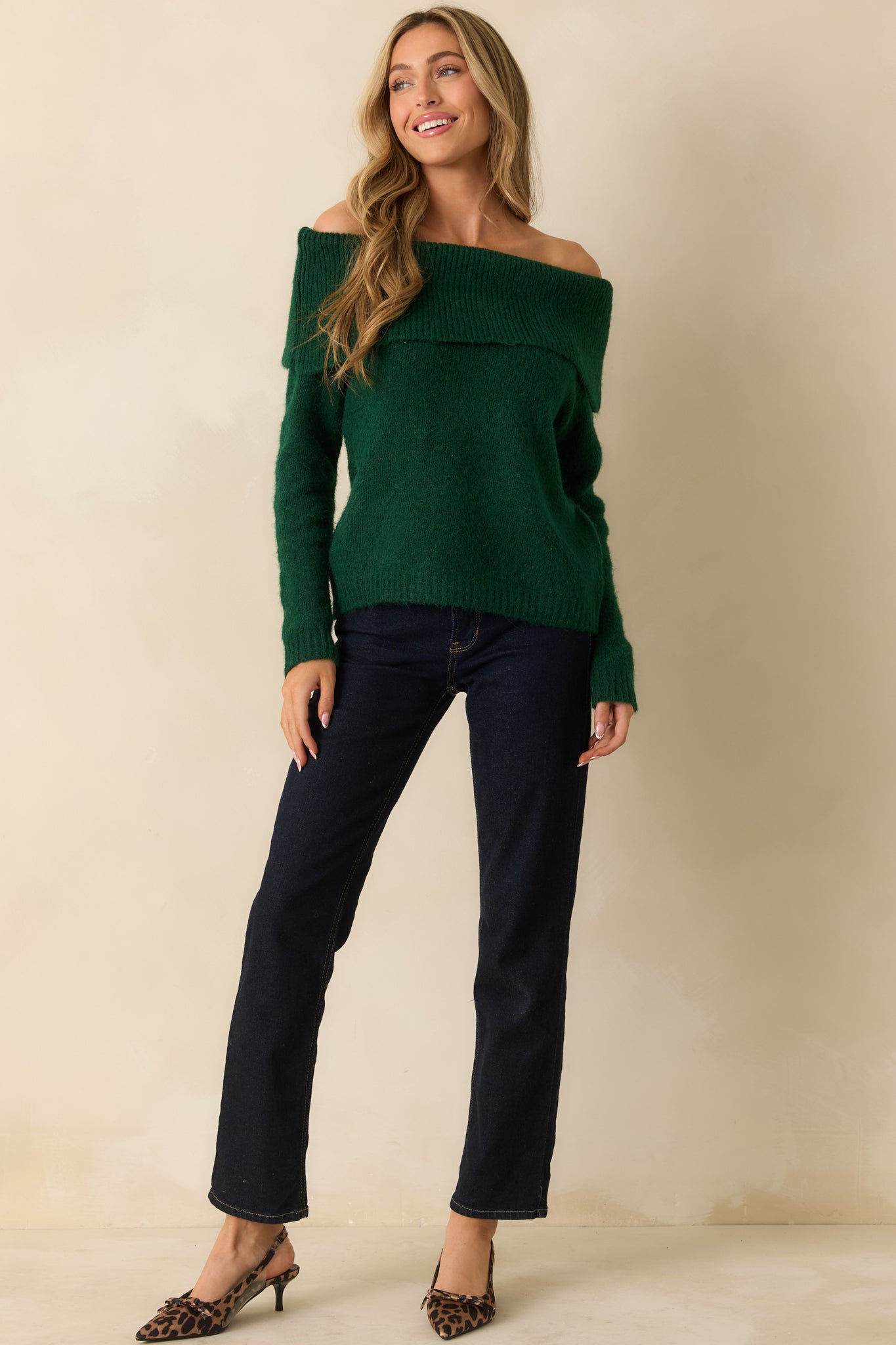 Emerald off-shoulder sweater with a wide foldover neckline, relaxed fit, long sleeves, and ribbed cuffs and hem.