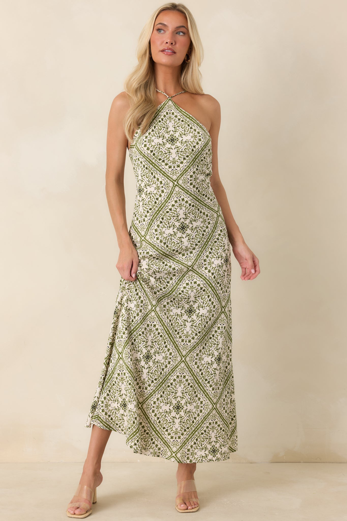 European getaway-inspired midi dress showcasing a colorful scarf print and graceful fitted design.