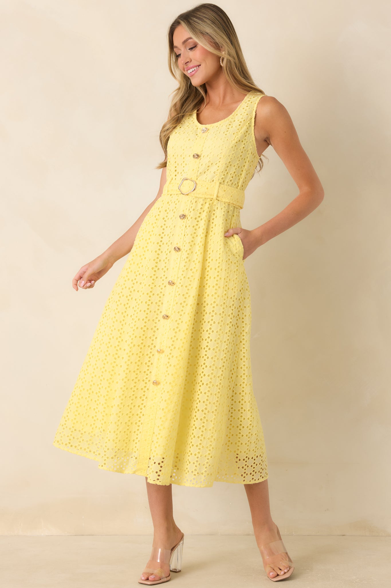 Midi dress highlighting intricate eyelet embroidery, lightweight cotton fabric, and a polished silhouette.