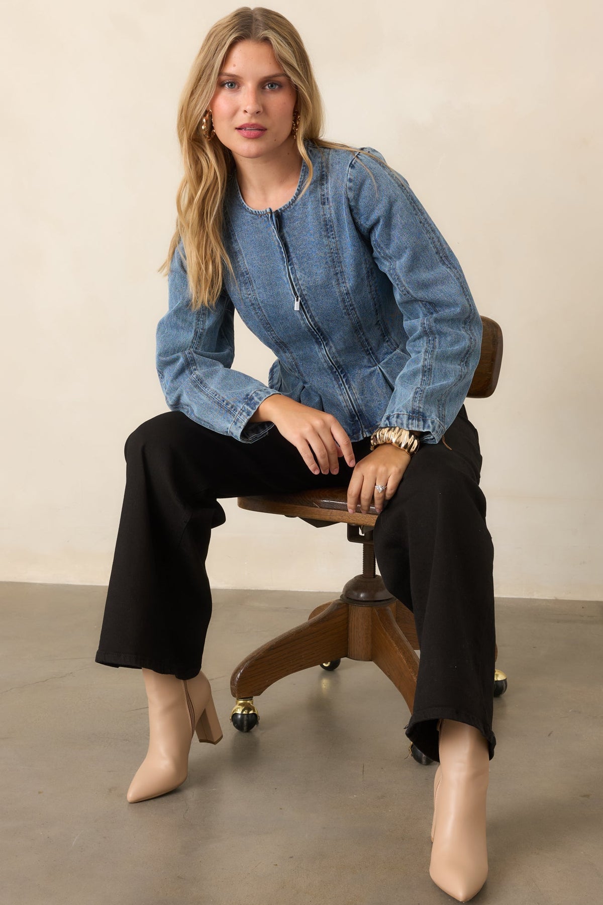 Faded cotton jacket with pleated waist panels and a flared hem.