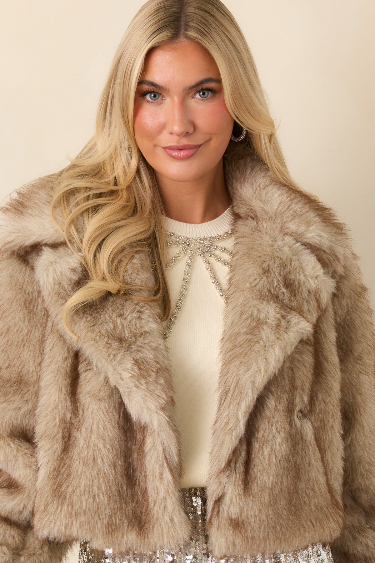 Front of the faux fur jacket showcasing its layered panels and oversized notched lapels.