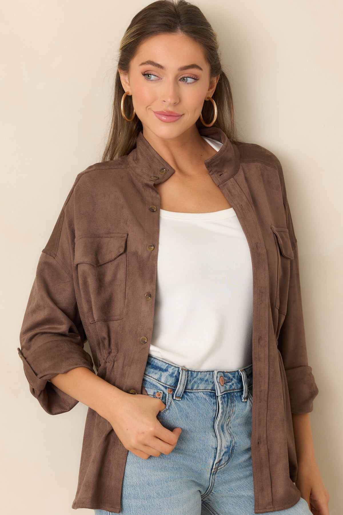 Roll-tab sleeve detail on the relaxed faux suede jacket with dropped shoulders.
