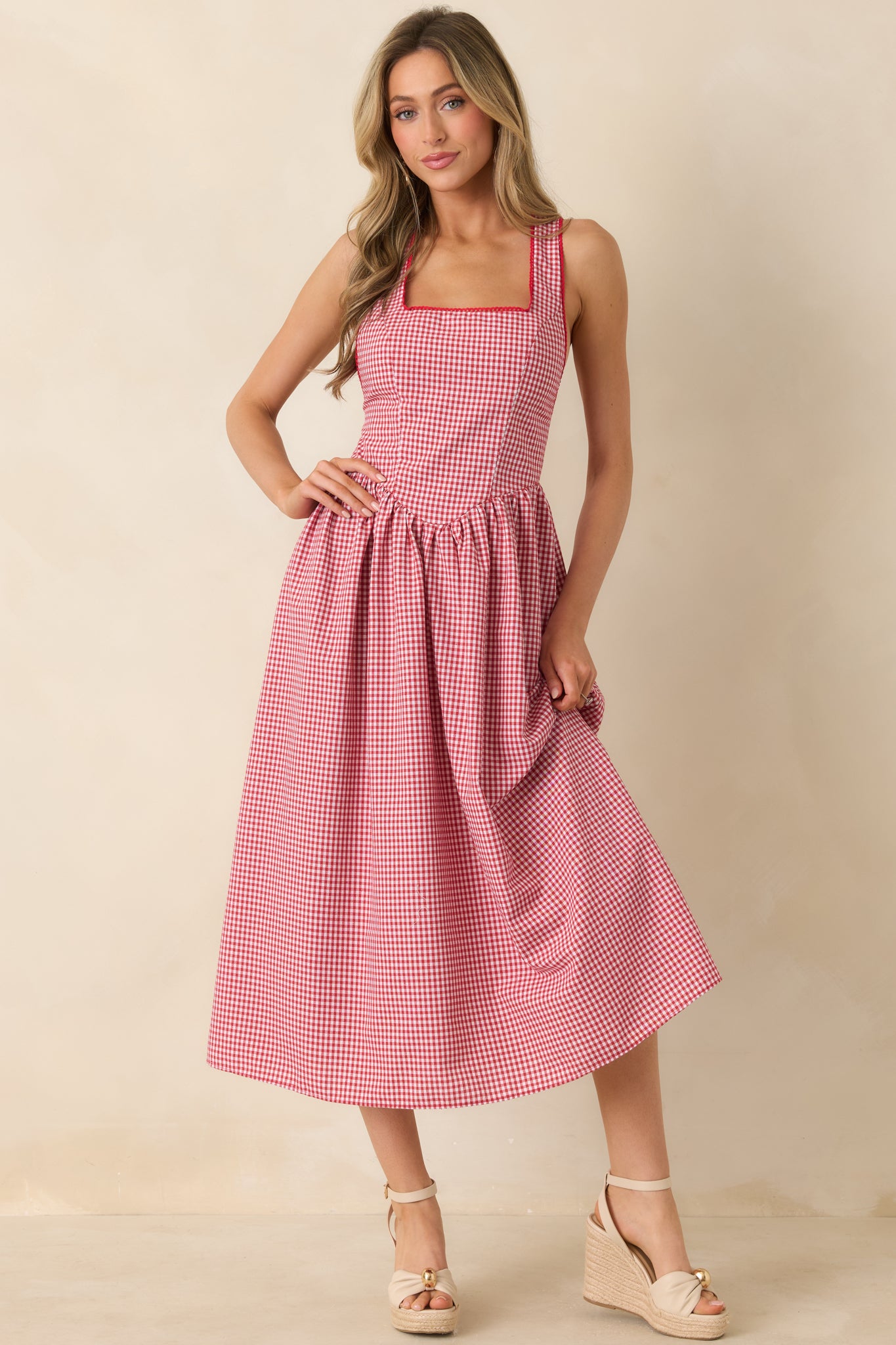 Feminine cotton dress with flattering fit and softly draped skirt design.