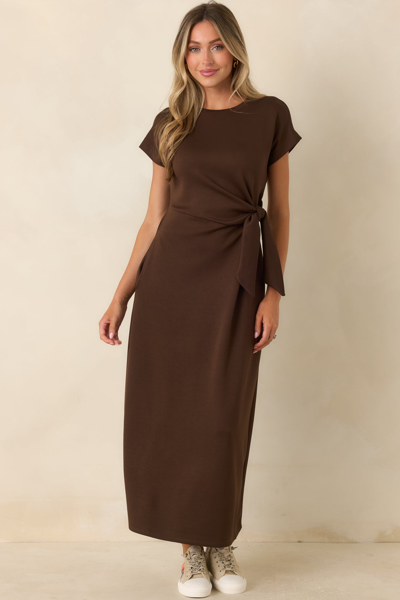 Feminine midi dress designed with a side knot detail, clean silhouette, and effortless polished style.