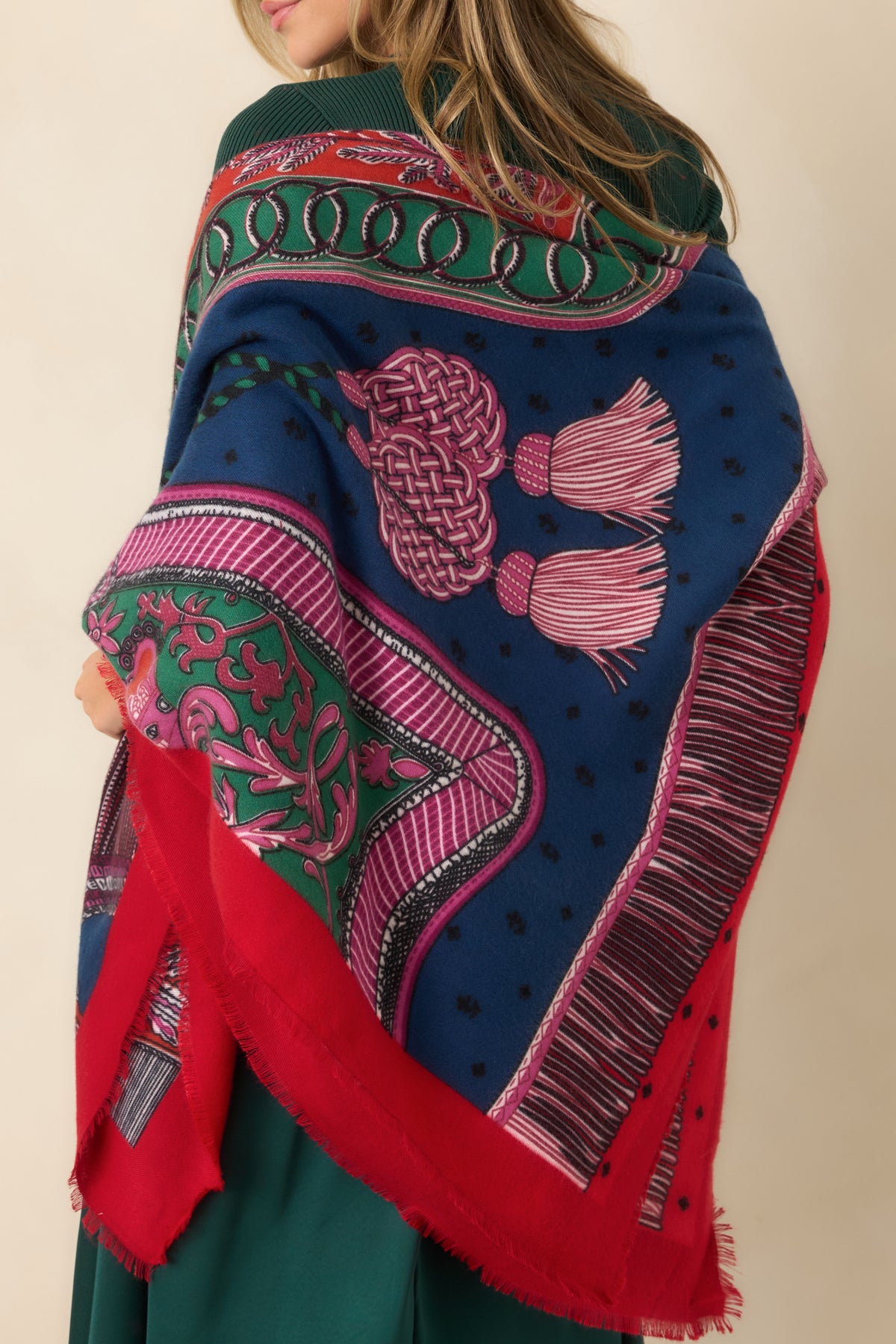 Fine fringe trim and intricate rope knots, tassels, and interlocking ring motifs in a colorful printed design.
