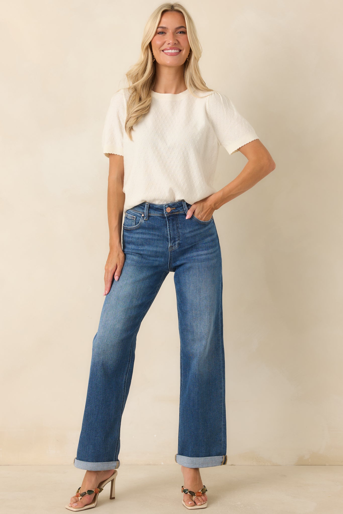 Lightweight fine-gauge knit top with feminine sleeve volume, ribbed details, and an elegant everyday fit.