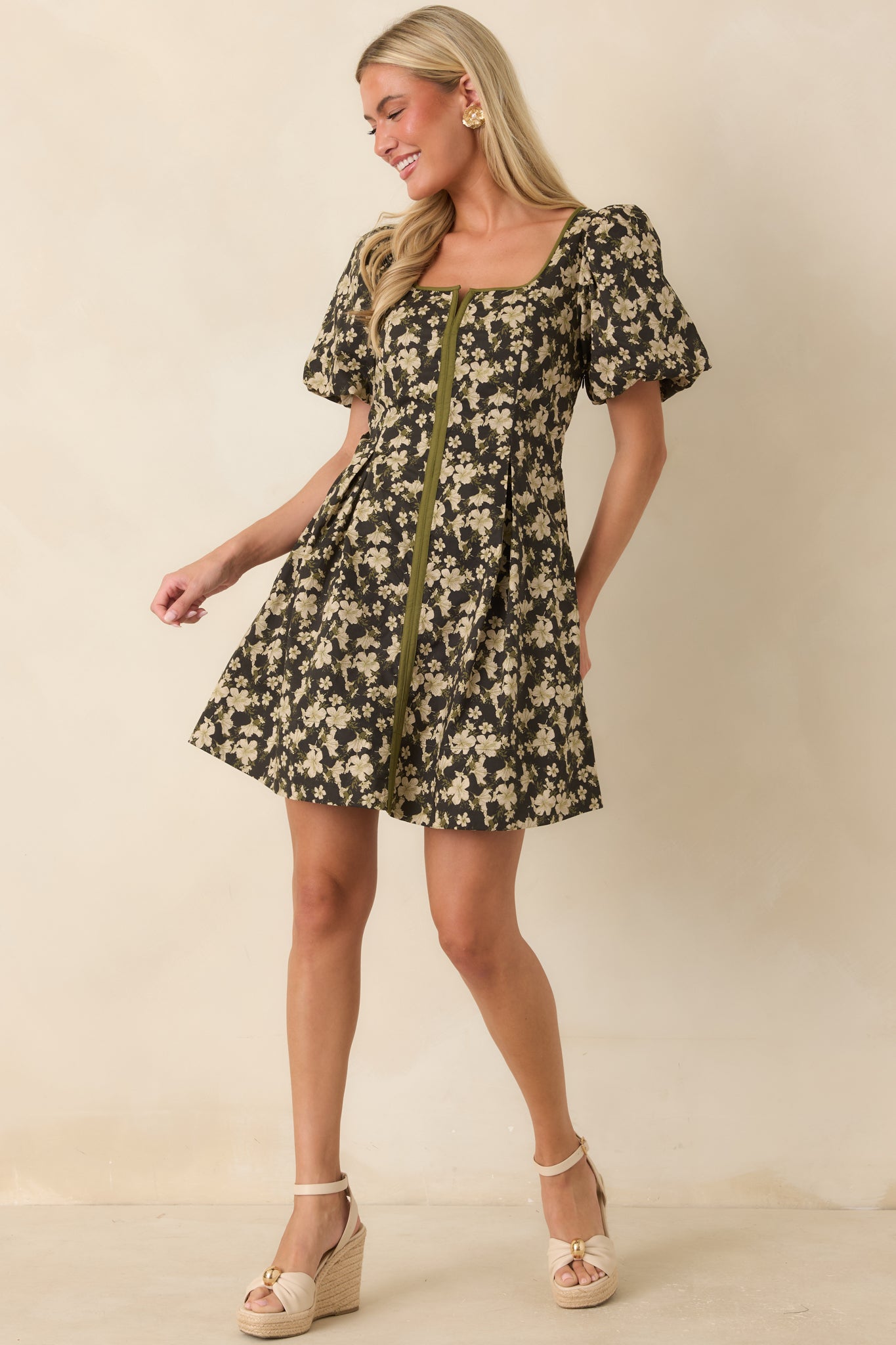 Fit-and-flare mini dress featuring puff sleeves, a square neckline, and structured waist pleating for added shape and movement.