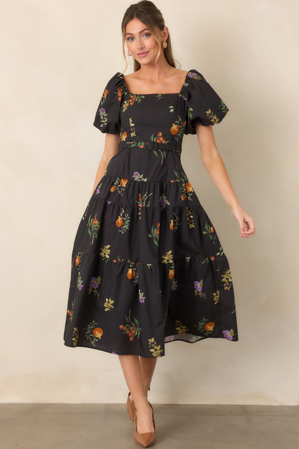Fitted cotton dress showcasing a trimmed square neckline, dramatic puff sleeves, coordinating belt, and flattering shaped bodice.