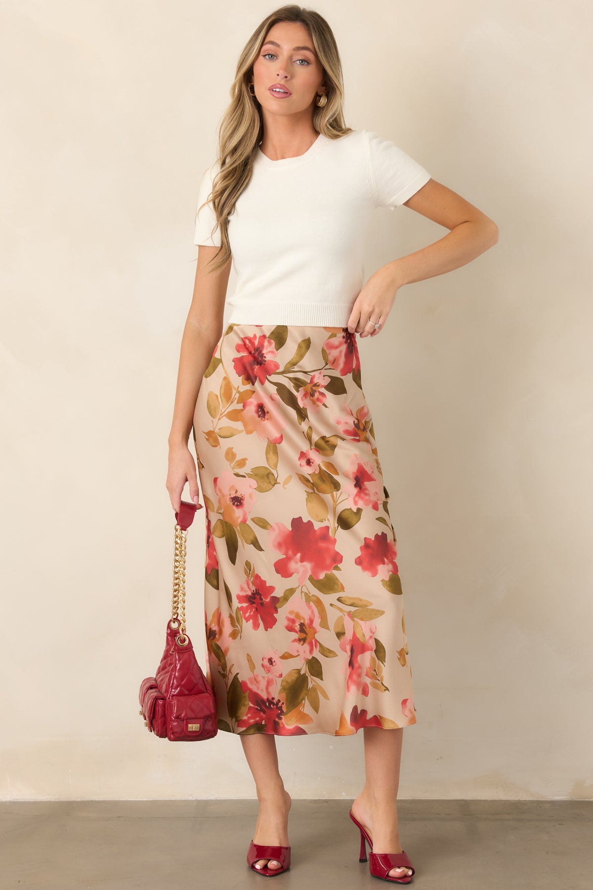 Fitted rayon-blend knit top featuring a classic crew neckline and short sleeves.