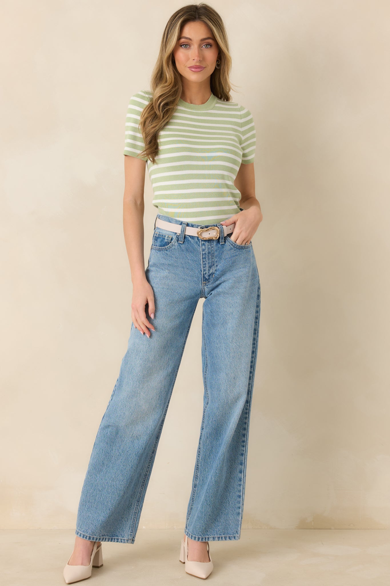Fitted short sleeve knit top with light green and ivory horizontal stripes, featuring a soft texture and classic crew neckline.
