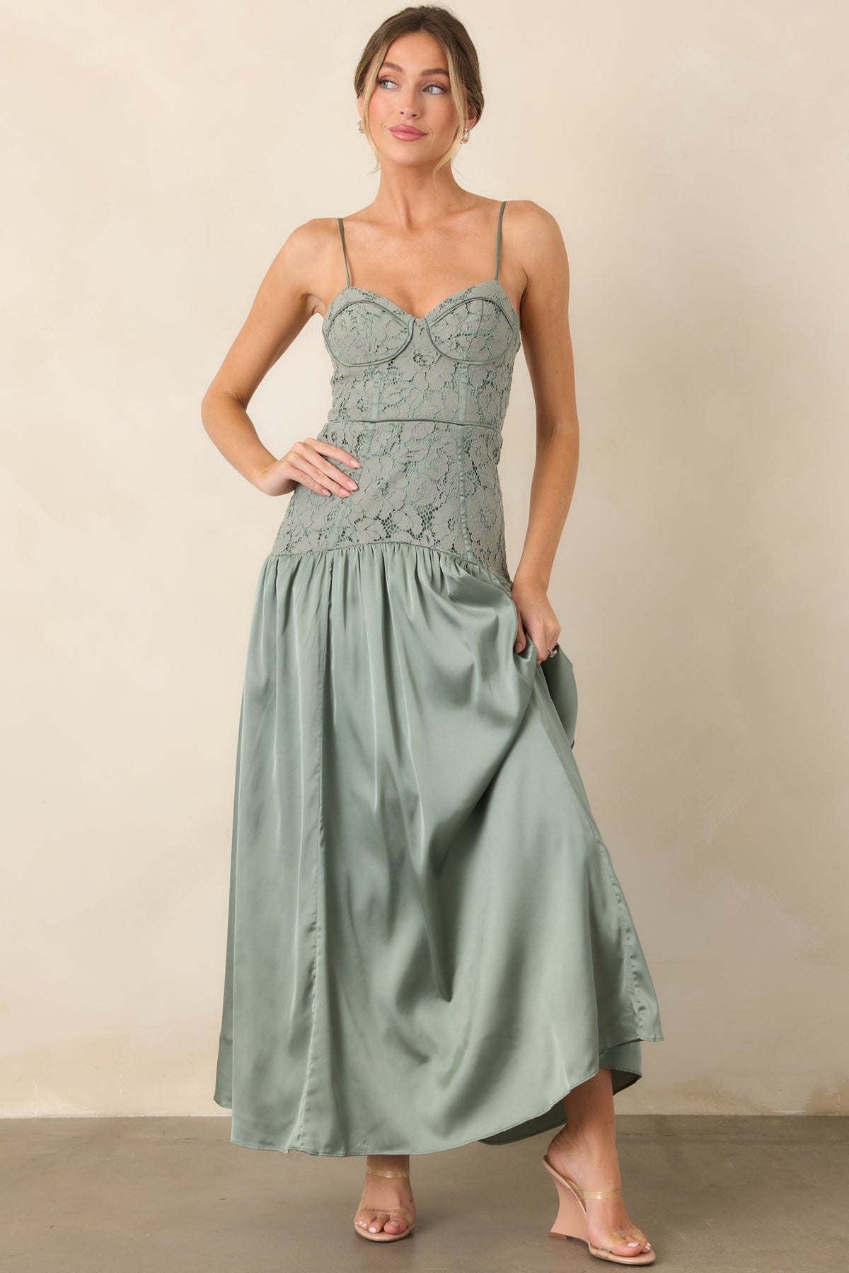 Fitted sweetheart dress with adjustable straps and gathered maxi skirt.