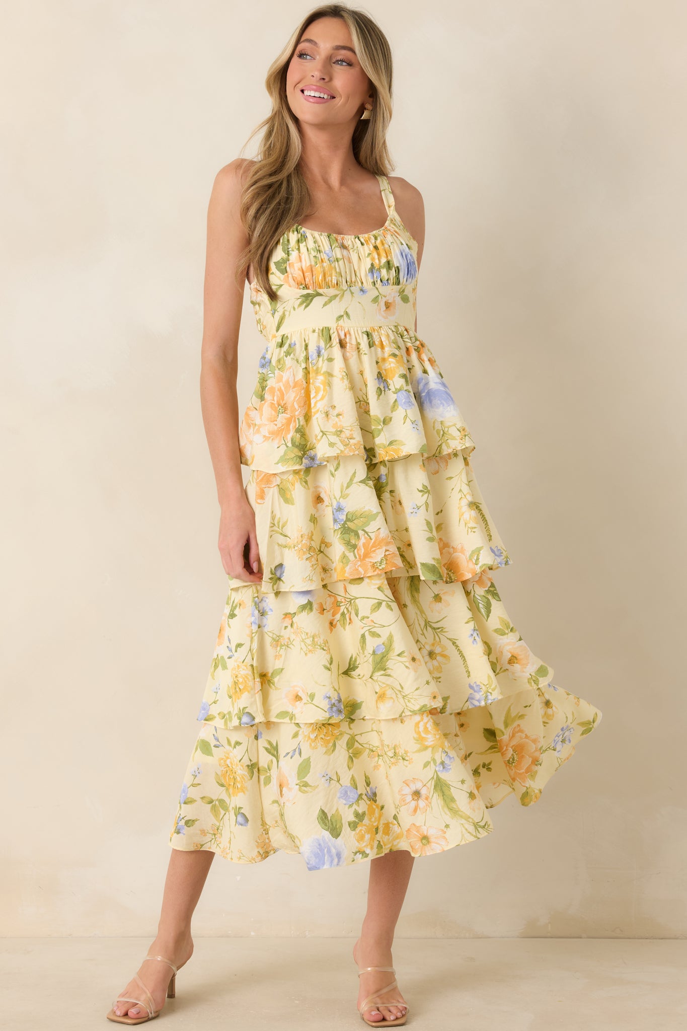 Floral maxi dress featuring a breezy tiered silhouette, gathered bust detail, adjustable shoulder straps, and an effortlessly flowing floor-length design.