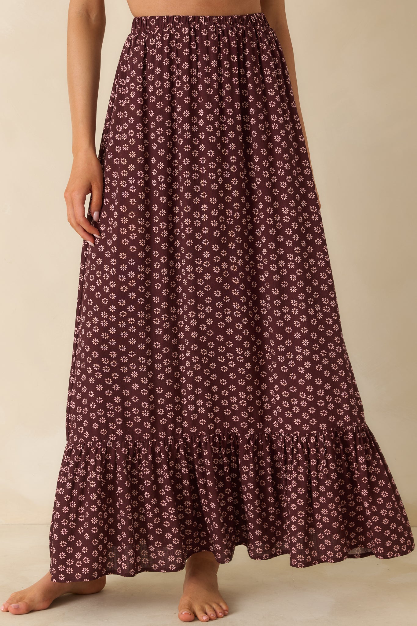 Floral burgundy skirt showing off its airy fabric and twirl-ready A-line sweep.