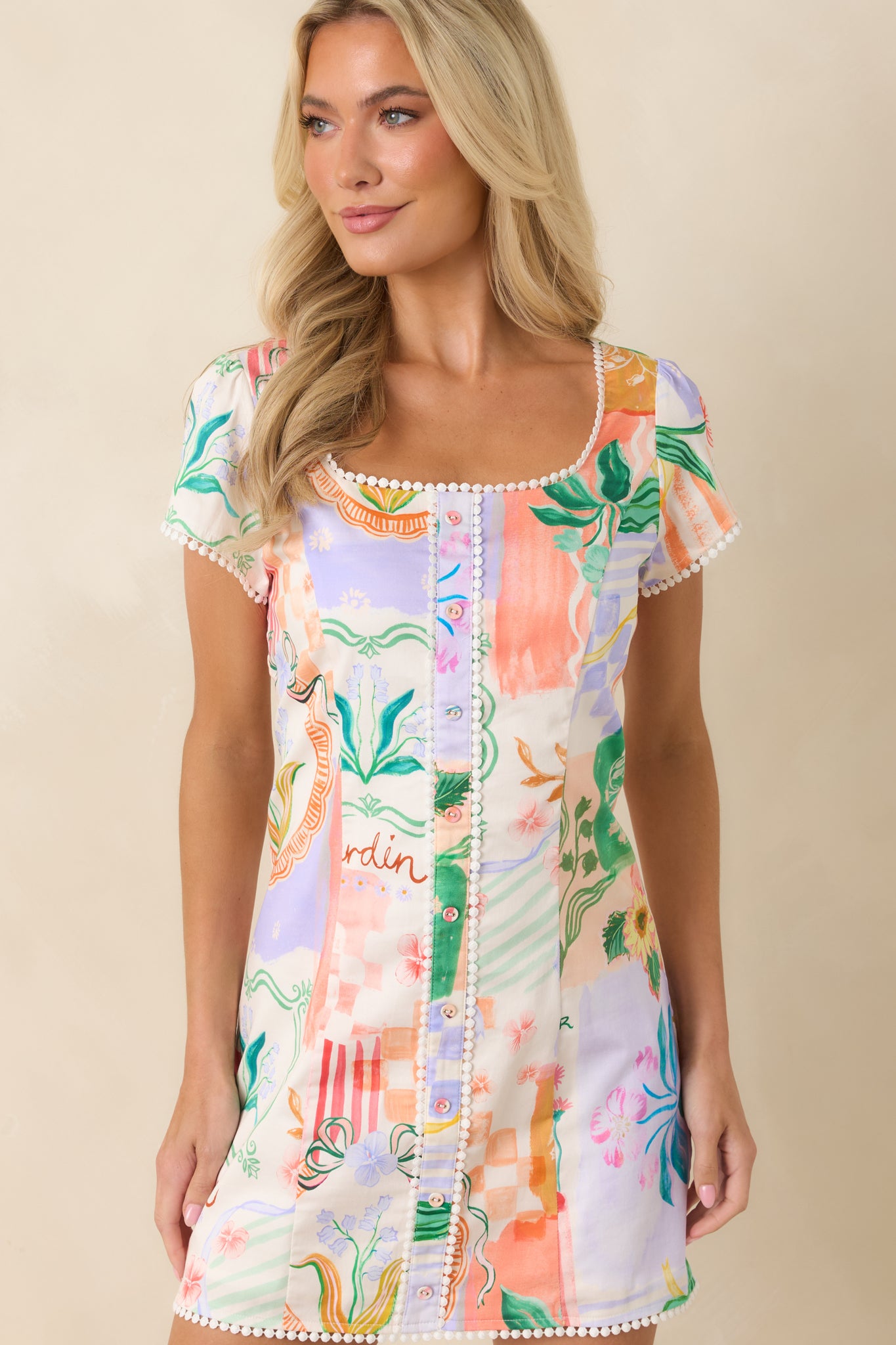 Closer view of the front bodice showcasing the square neckline, decorative buttons, and intricate trim details.