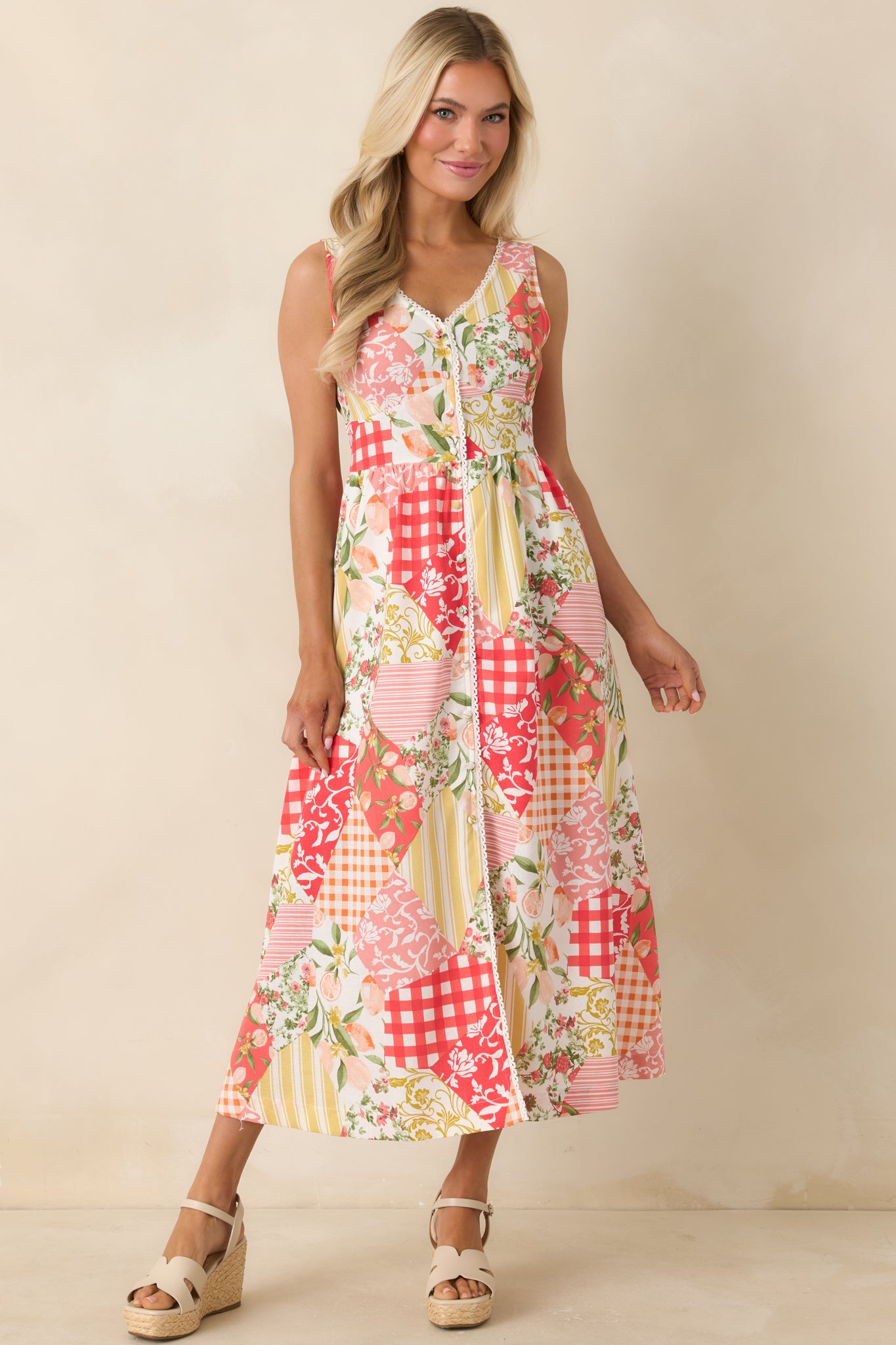 Floral gingham and citrus print midi dress featuring a feminine lace-trimmed neckline and balanced silhouette.