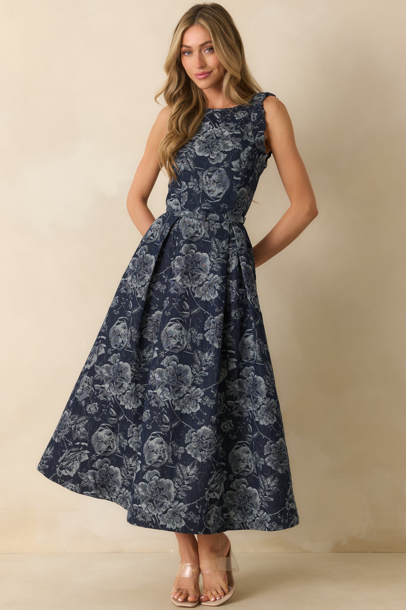 A full length front-facing view showcasing the overall silhouette, high neckline, and detailed floral jacquard pattern.