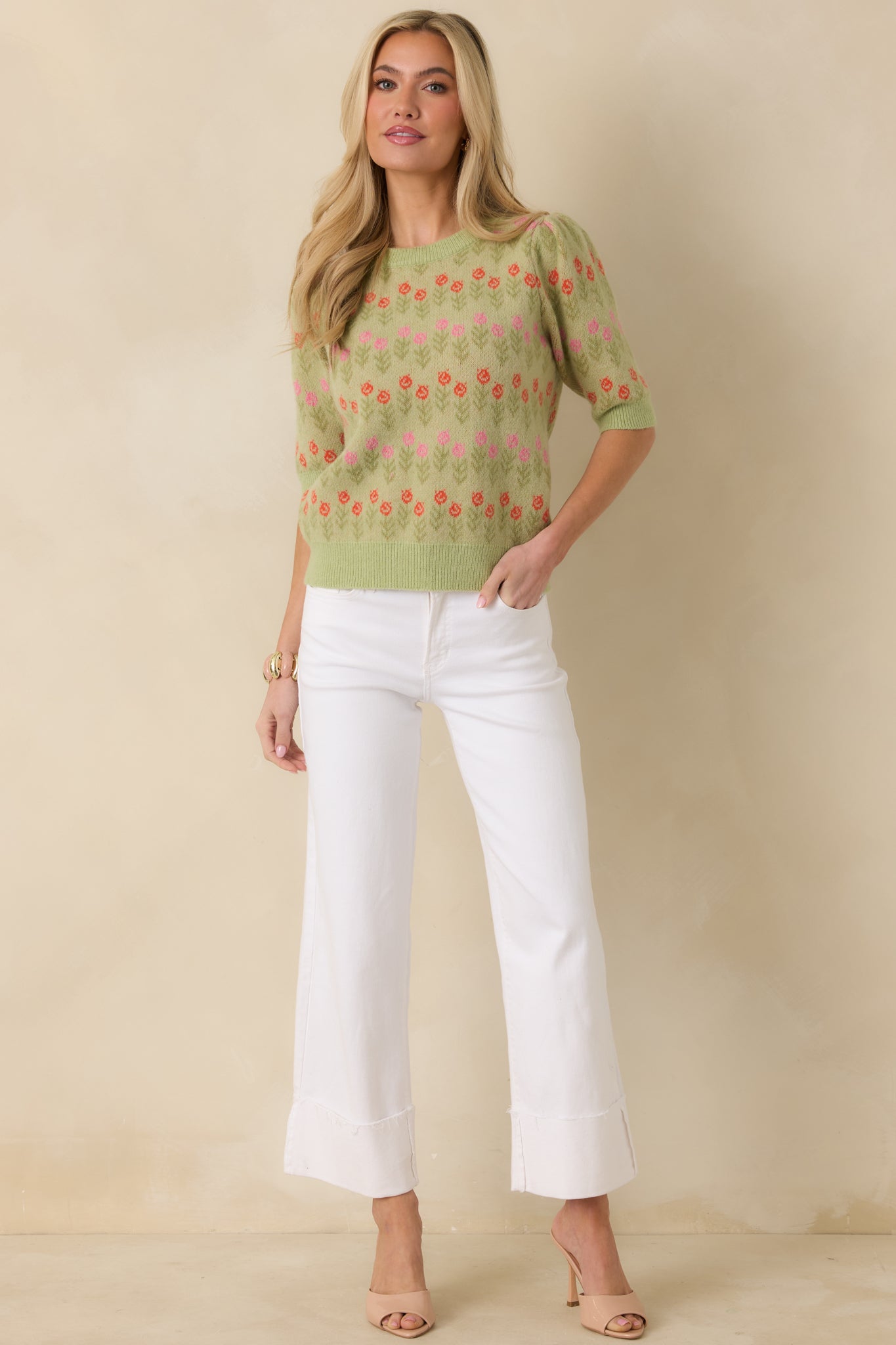 Floral jacquard light green sweater with short sleeves and lightweight knit fabric for layering.