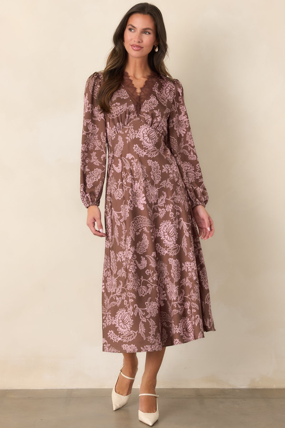 Floral lace print dress with a sheer brown eyelash lace V-neckline and long sleeves.
