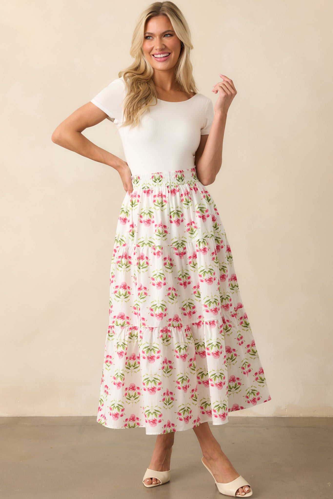 Front-facing image of the floral maxi skirt, featuring a smocked elastic waistband and ankle-grazing length.
