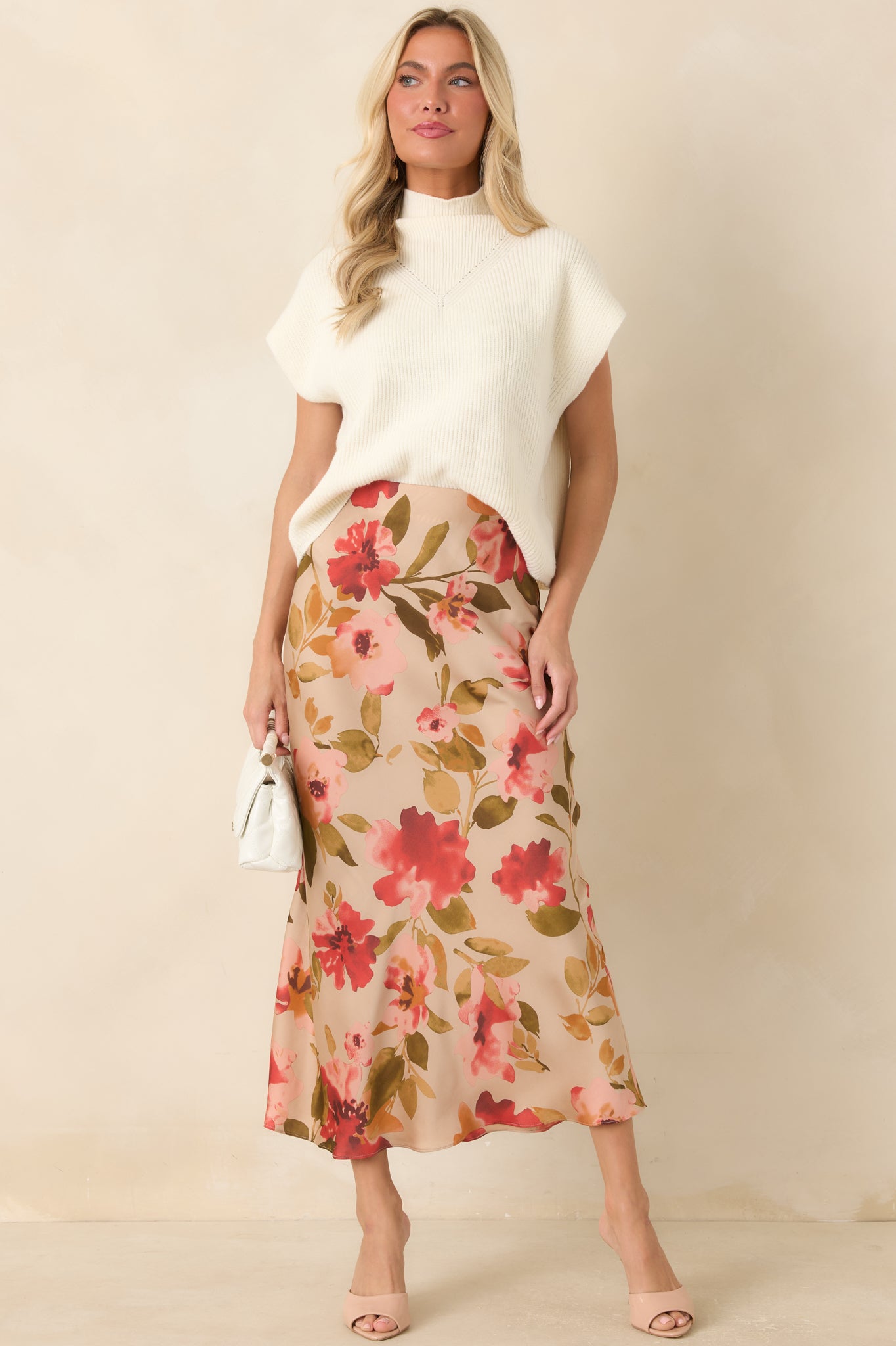 Floral maxi skirt designed with a soft watercolor print, comfortable elastic waist, and a hidden side zipper closure for a clean finish.