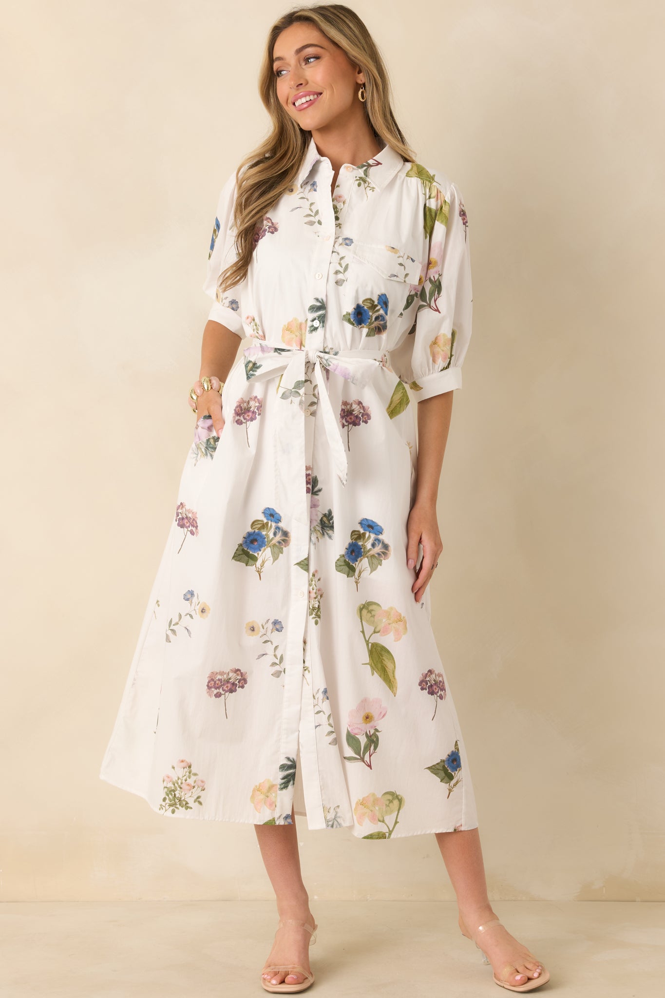 Floral midi dress featuring a collared neckline and a classic button-front closure.