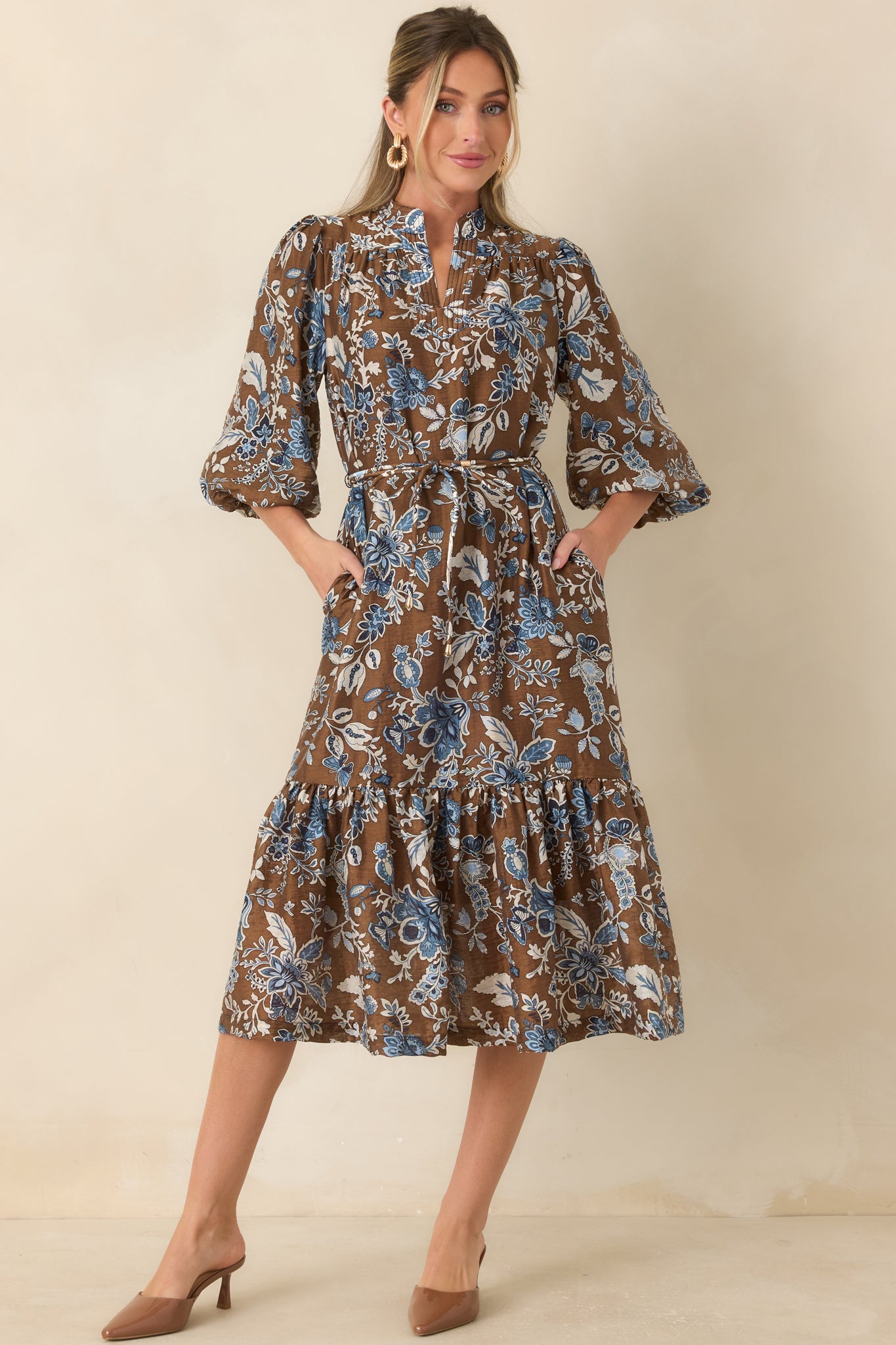 Printed midi dress featuring multicolor blue florals, neckline pintuck detailing, balloon sleeves, and a softly flowing silhouette.