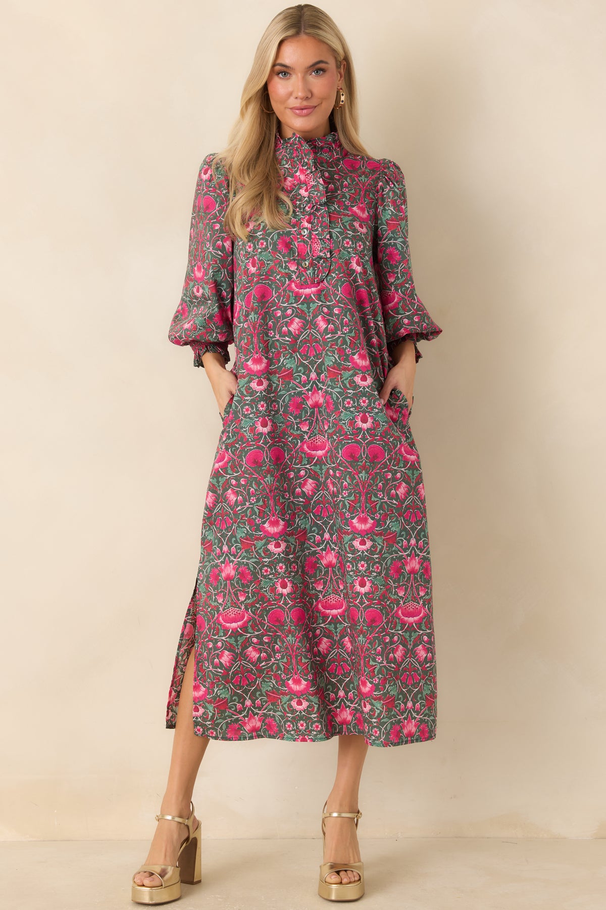 Floral midi dress with three-quarter puff sleeves, ruffled cuffs, and a partial button placket.
