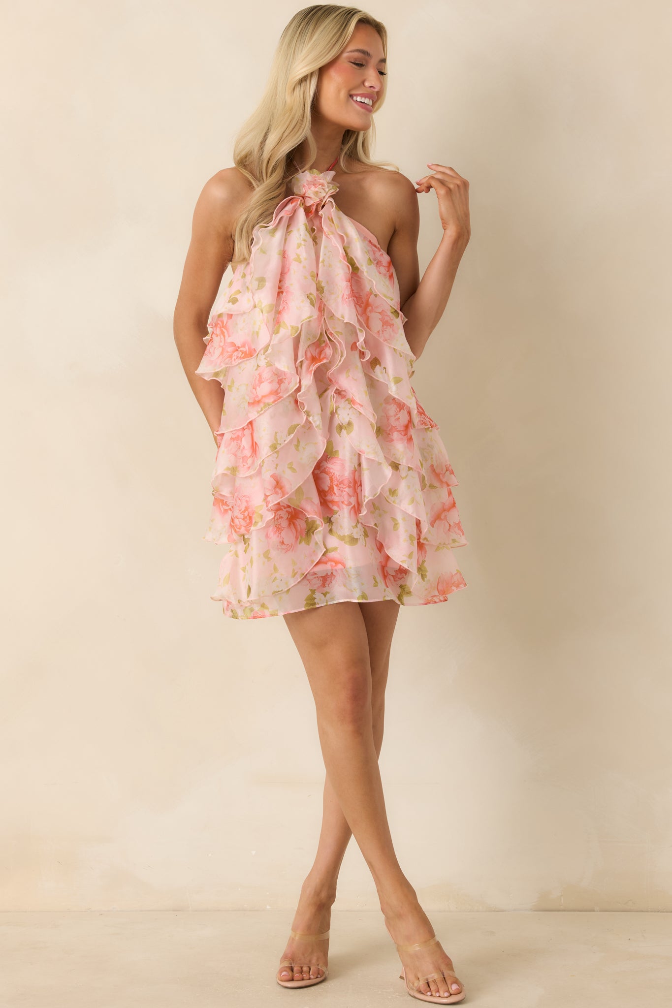 Floral mini dress showcasing a statement neckline detail and a lightweight, voluminous ruffled construction.