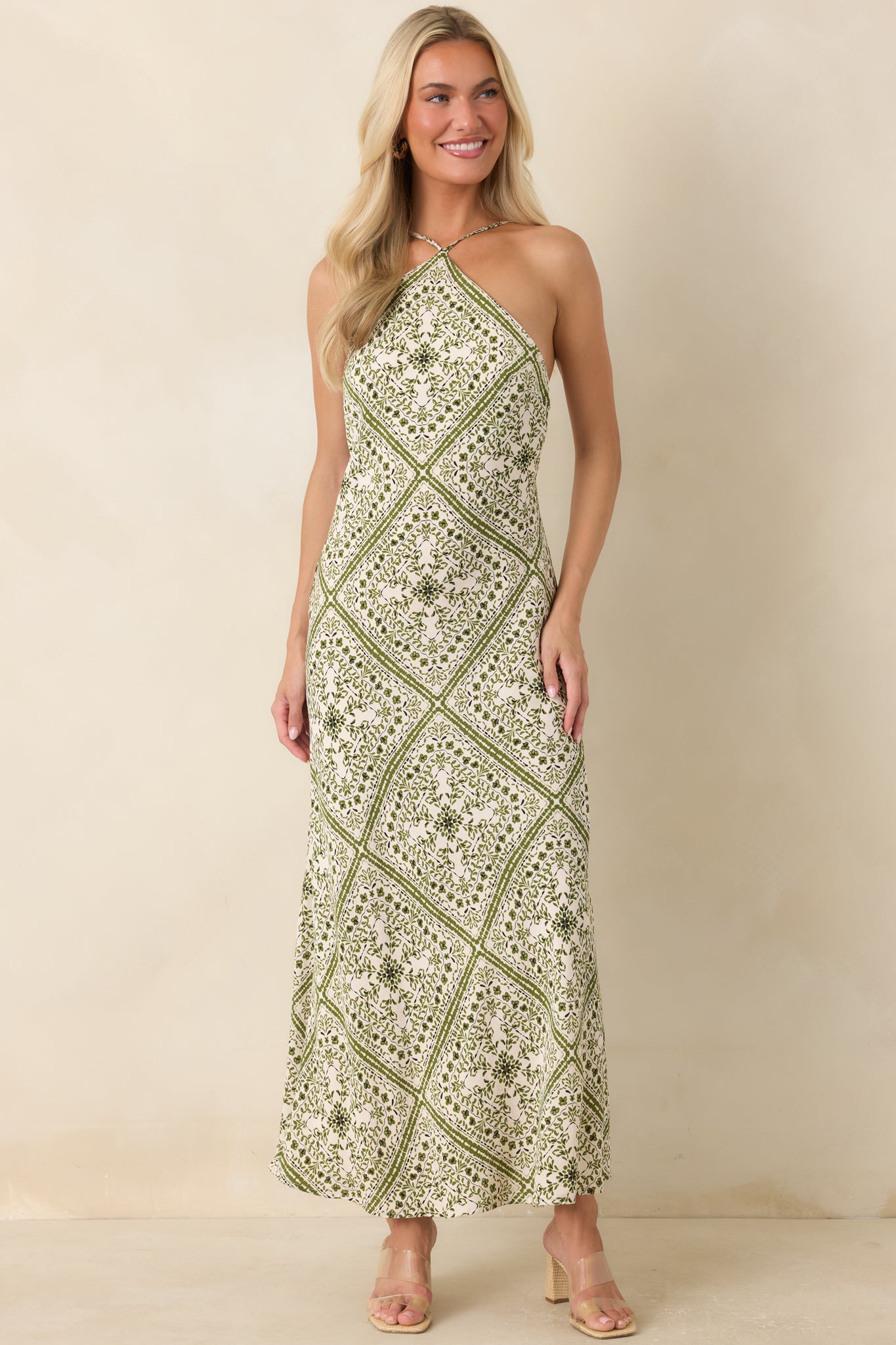 Scarf-inspired floral midi dress featuring a sleek column silhouette and refined bateau neckline.