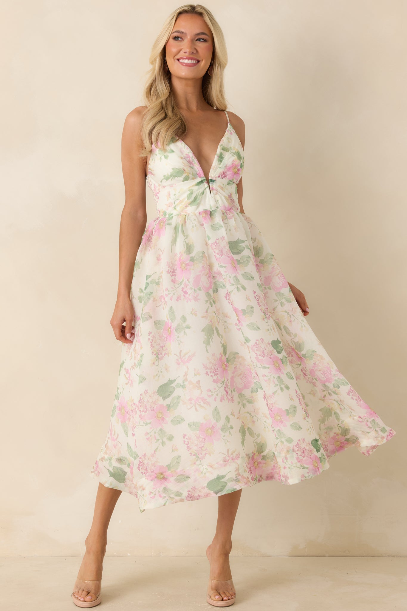 Floral print midi dress with a smocked elastic back panel and a lightweight, flowing shape.