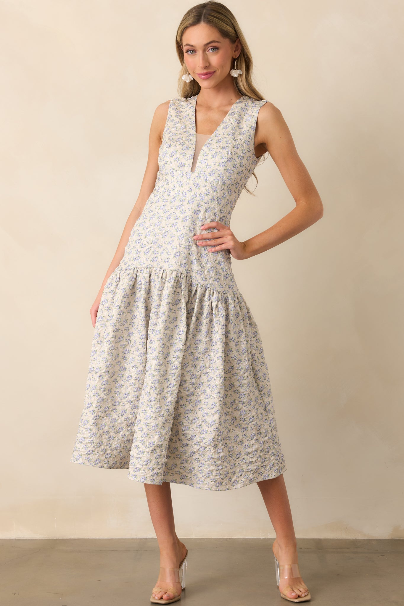 Front view of the floral print midi dress with subtle sheen, highlighting its soft structure and feminine shape.
