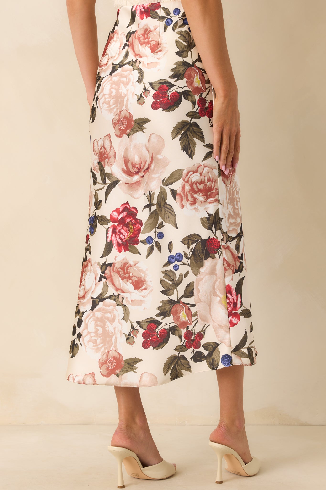 A back view of the skirt displaying the continuous floral pattern and smooth fit across the waist and hips.
