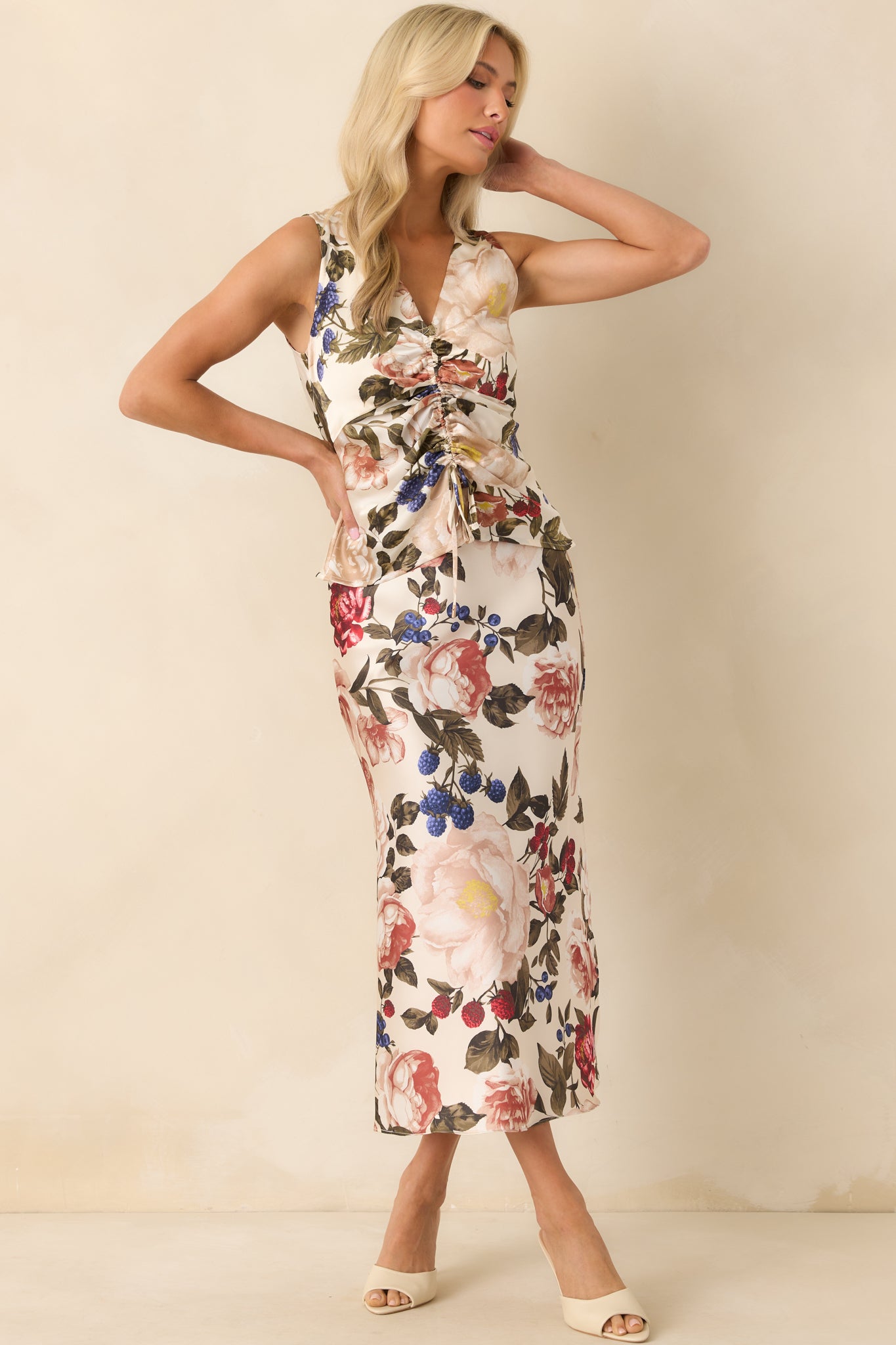 A posed full-body shot highlighting the elastic waistband and flow of the floral fabric.