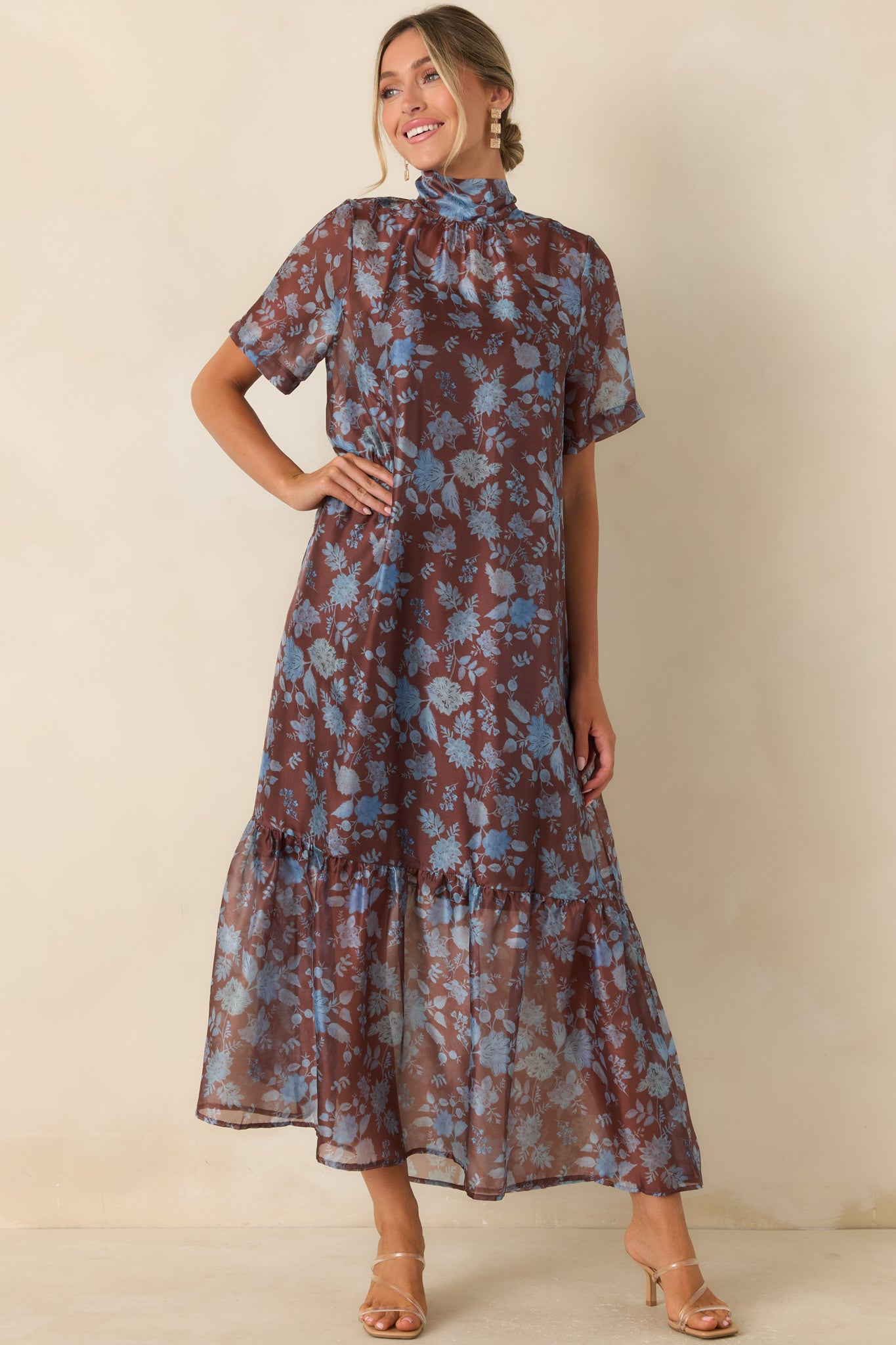Floral maxi dress designed with a lightweight printed overlay, tiered hem detail, and an effortlessly elegant shape.